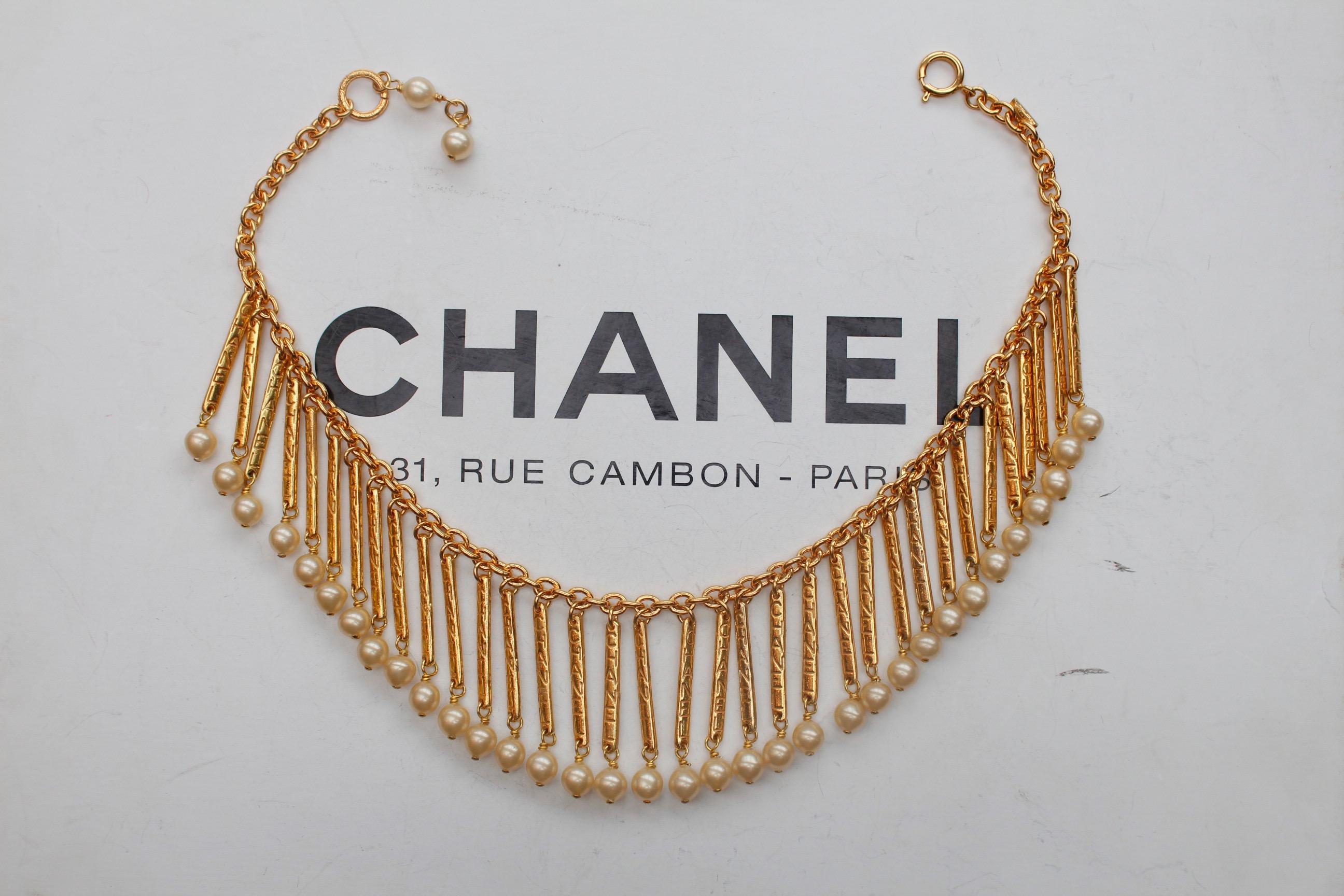 Women's CHANEL 1980s Gilted metal breastplate necklace with hanging sticks