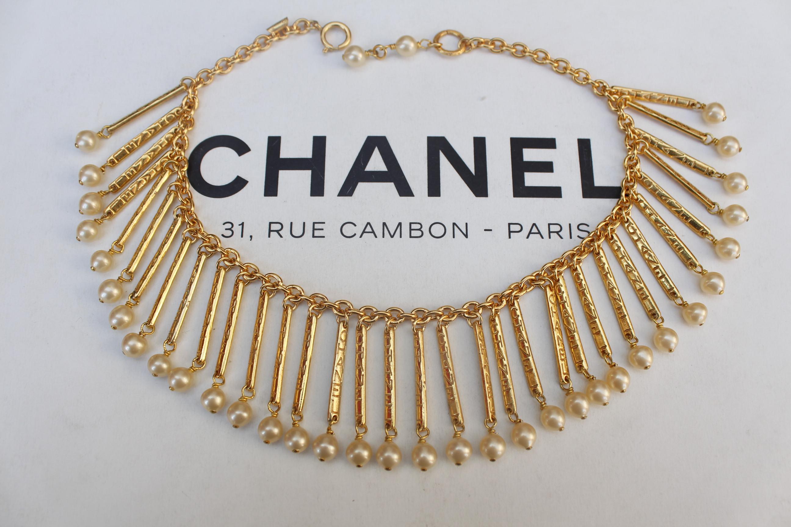 CHANEL 1980s Gilted metal breastplate necklace with hanging sticks 1