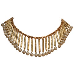 CHANEL 1980s Gilted metal breastplate necklace with hanging sticks