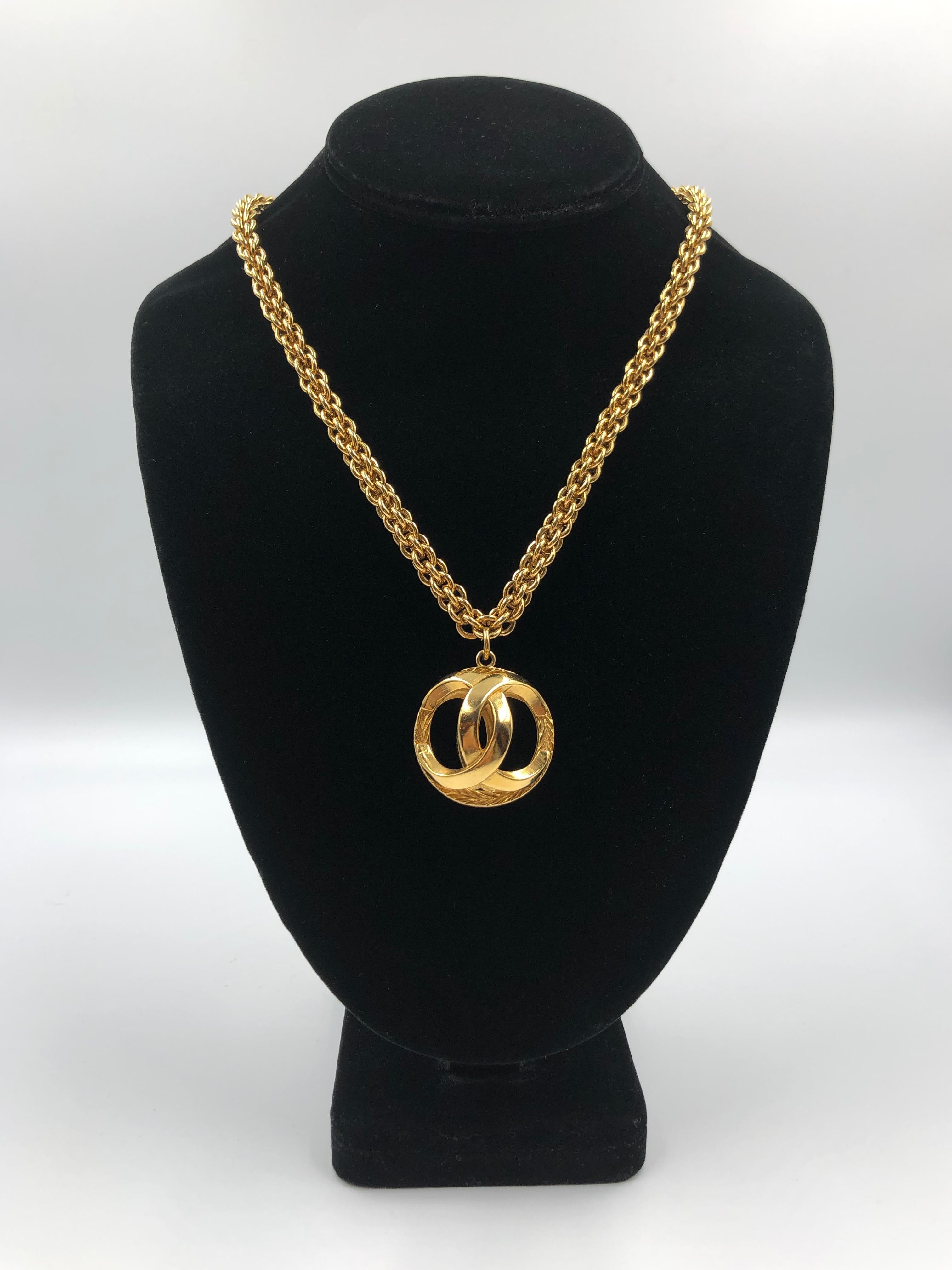 Chanel 1980's Gold Tone Necklace with 3D Orb Monogram Double CC Pendant

Length (Doubled): 18