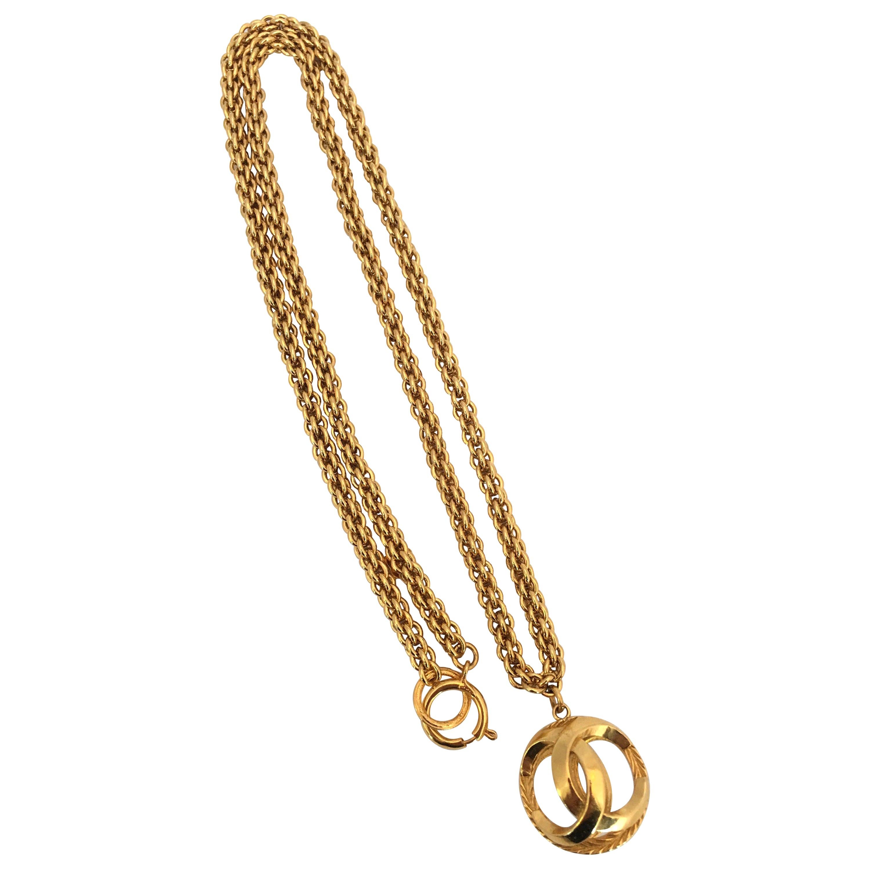 Chanel 1980's Gold Tone Necklace with 3D Orb Monogram Double C Pendant at  1stDibs