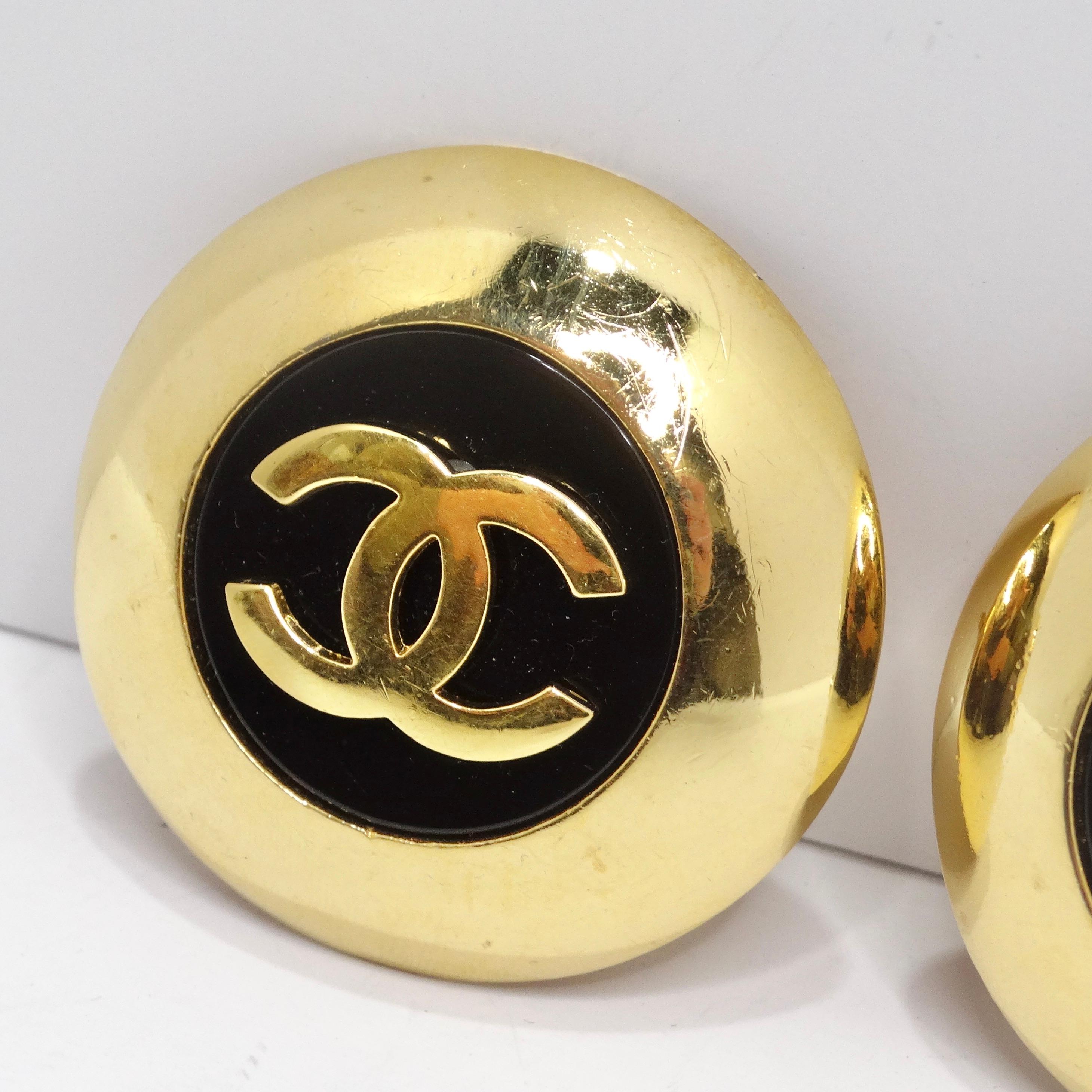 Step into the world of iconic elegance with the Chanel 1980s Jumbo Gold Plated Black CC Logo Clip-On Earrings – jumbo disc-shaped earrings that are a true testament to the glamour of 80s Chanel. These statement earrings feature gold-plated discs