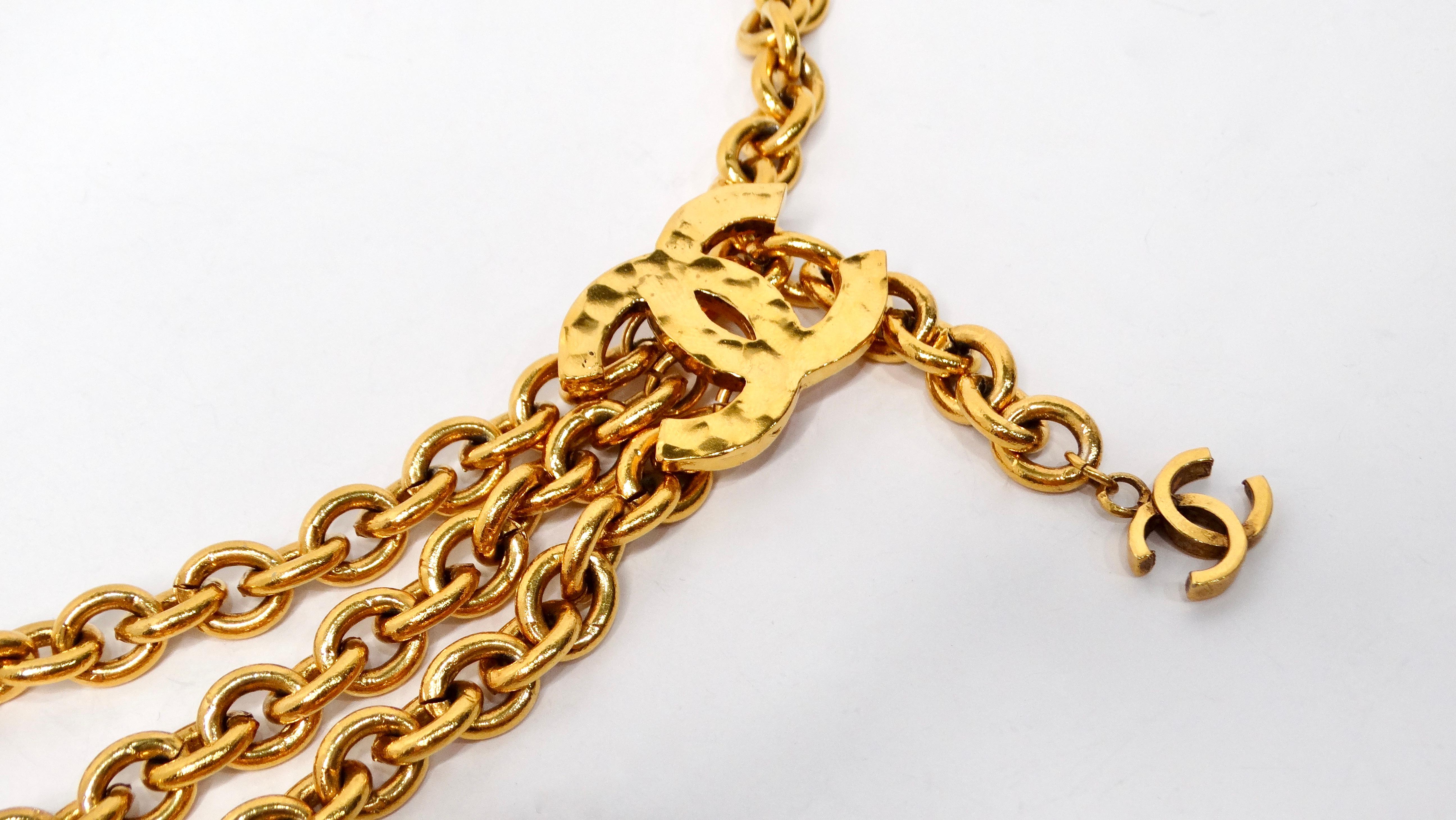 The Chanel 1980s Yellow Gold-Tone CC Logo Triple Chain Belt is a stunning piece of costume jewelry that embodies the exuberance of the 1980s and the legendary design principles of Karl Lagerfeld’s Chanel era. This statement belt features a single