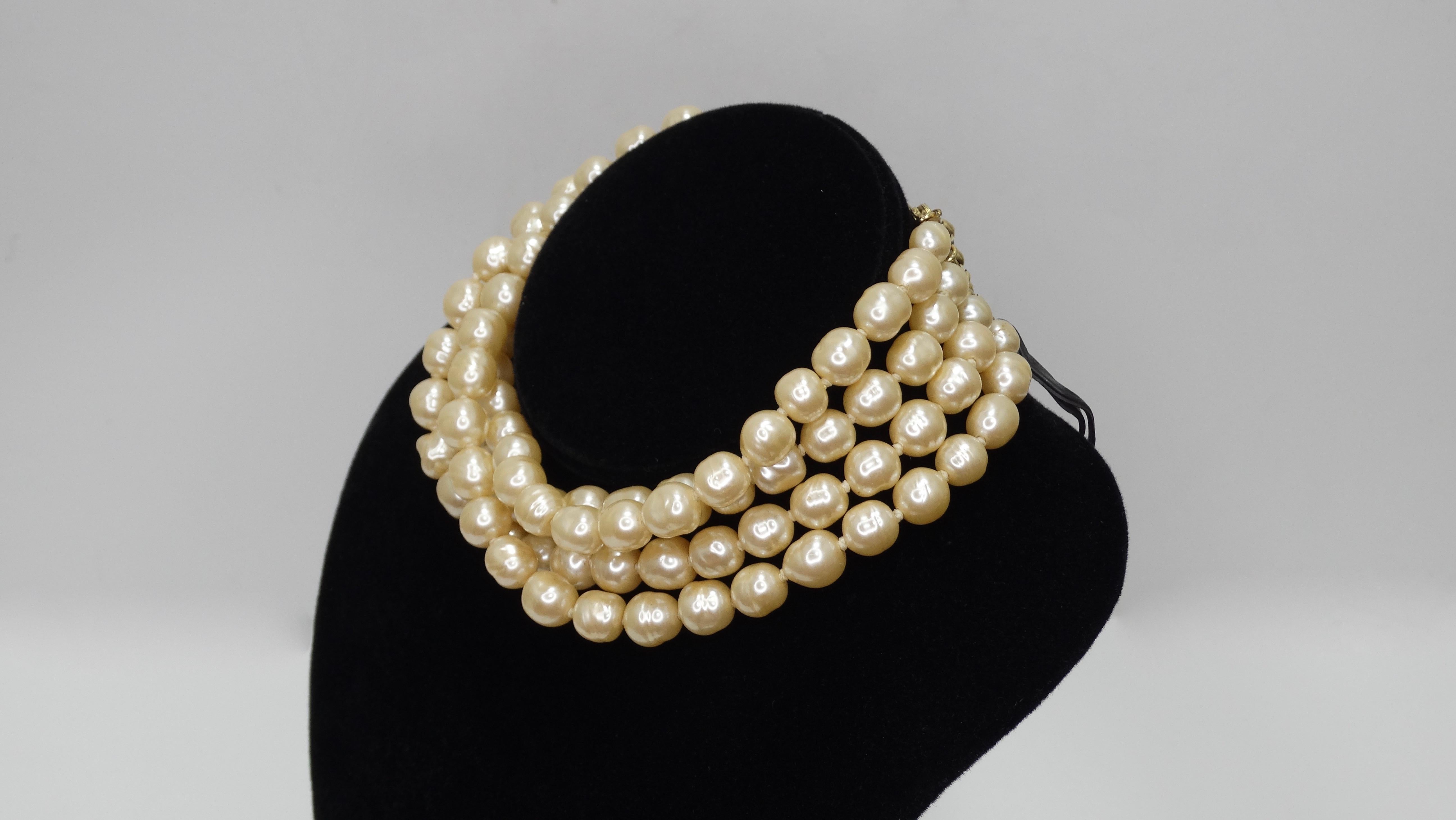 It doesn't get anymore classic than this stunning Chanel choker! Circa 1981, this choker features multi-strands of faux pearls with baroque style gold plated accents and a hook closure. Timeless and chic, this necklace will pair perfectly with your