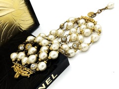 Chanel 1984 Gold Plated 6-Row Pearl Bracelet with Rhinestone Rosettes