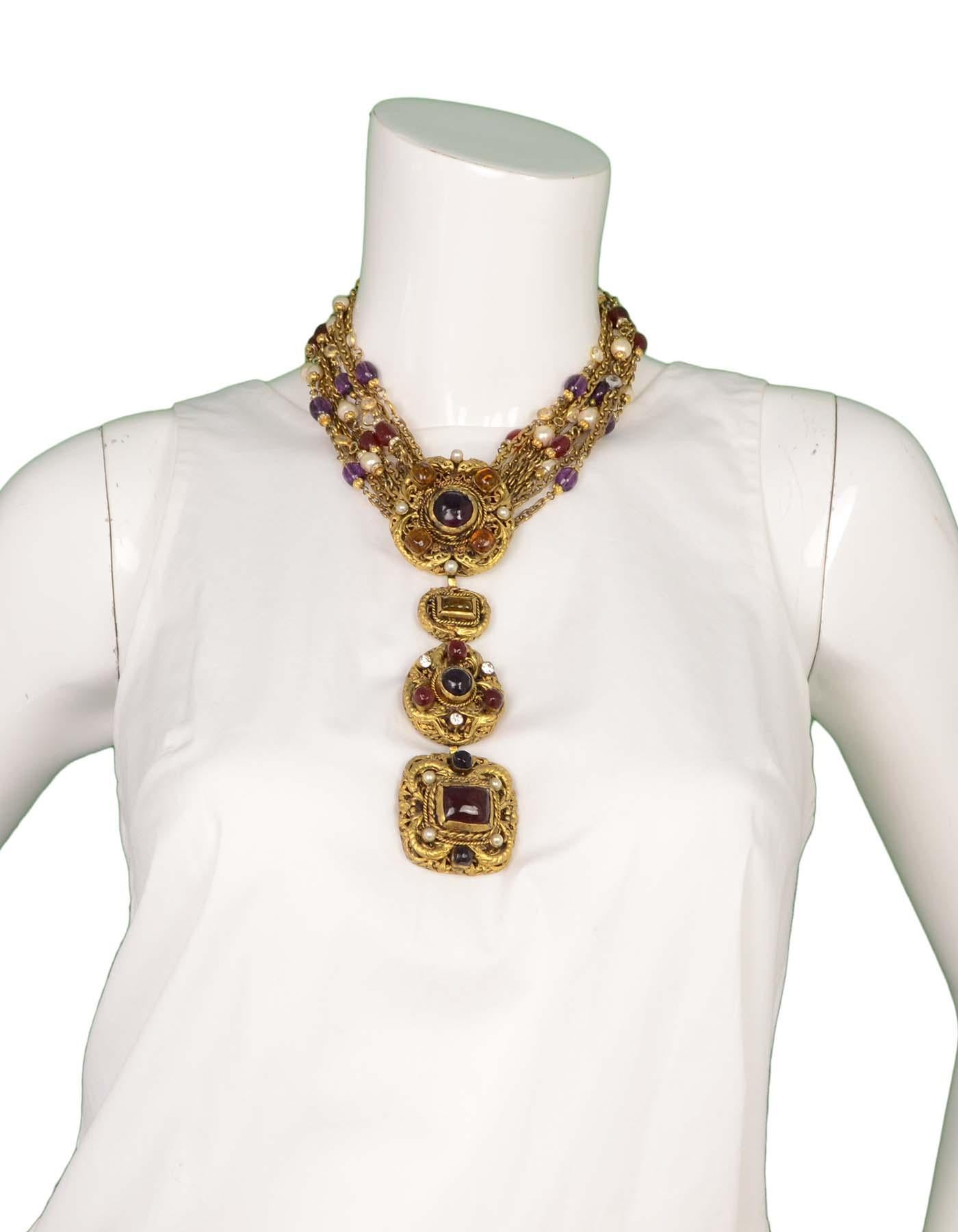 Chanel Vintage '84 Multi-Strand Gripoix & Faux Pearl Medallion Necklace 
Features three detachable medallions with gripoix and faux pearls

Made In: France
Year of Production: 1984
Color: Goldtone, red, purple, orange and ivory
Materials: Metal,