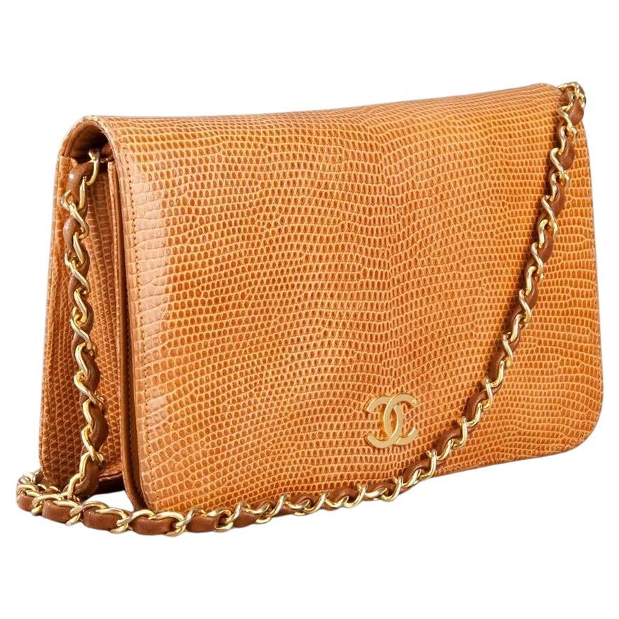 Chanel 1986 WOC Classic Flap Bag and Clutch Camel Beige Faux Lizard Skin Bag

1986 {VINTAGE 38 Years}

Beige camel printed lizard skin bag from Chanel Pre-Owned featuring a hard flap closure with magnetic fastening and gold-tone designer logo,