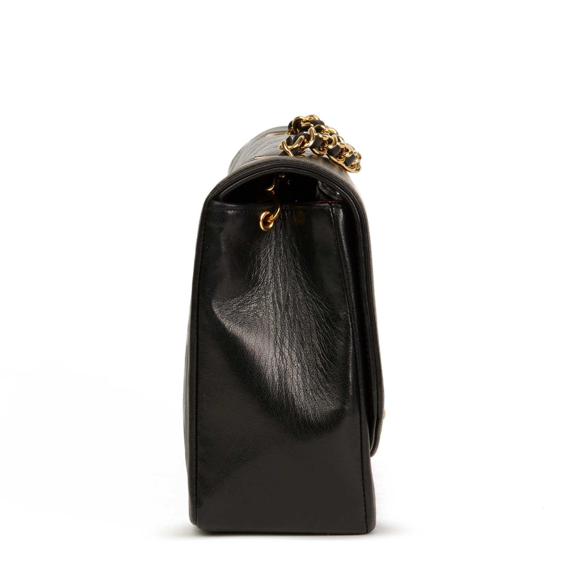 CHANEL
Black Quilted Lambskin Vintage Medium Diana Classic Single Flap Bag

 Reference: HB2749
Serial Number: 1881445
Age (Circa): 1990
Accompanied By: Chanel Dust Bag, Box, Authenticity Card
Authenticity Details: Serial Sticker, Authenticity Card