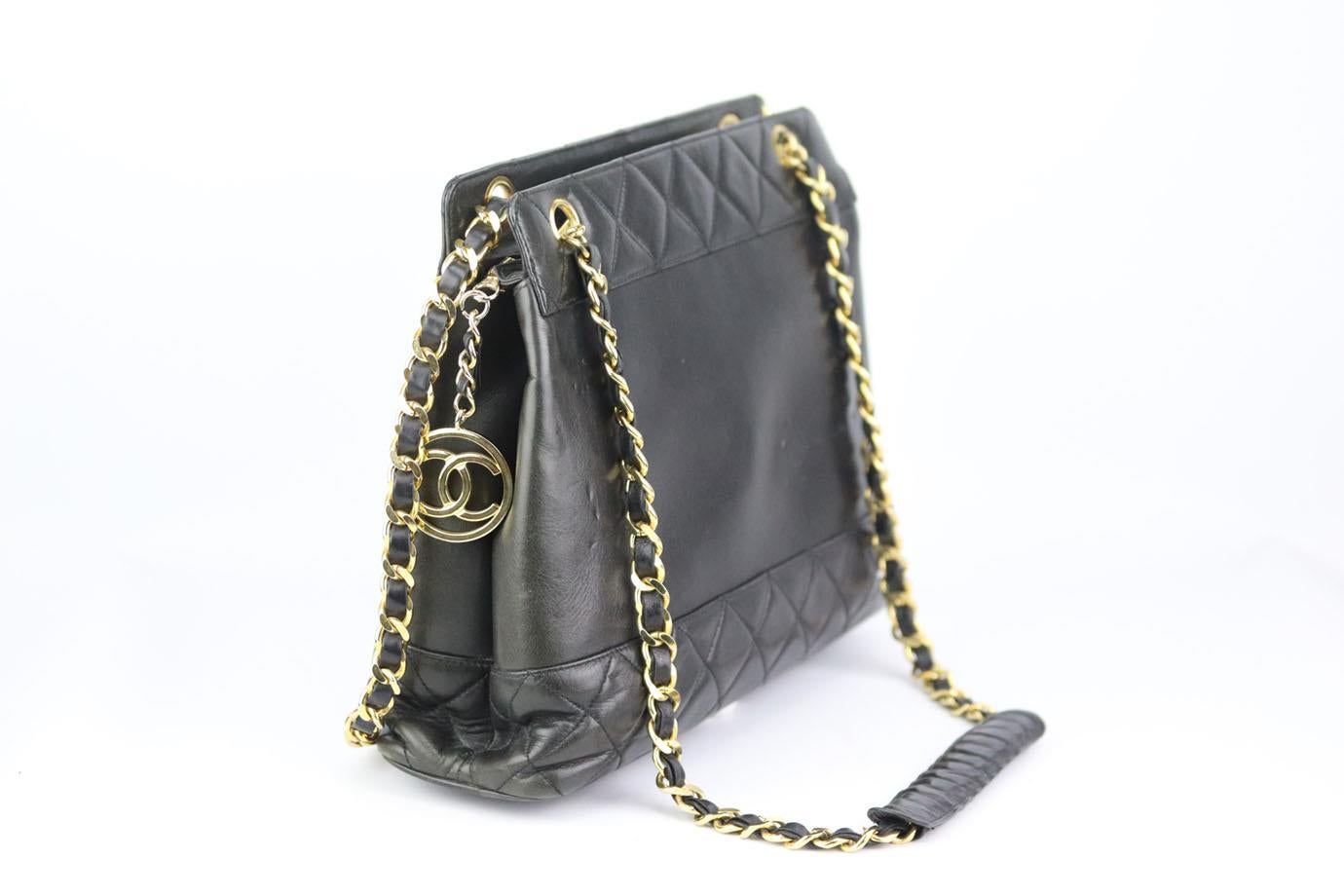 This beautiful 1990’s Chanel shoulder bag has been made from the softest black leather exterior, this piece is decorated with quilted leather at the bottom and finished with a gold chunky chain, leather strap and logo pendant. Black leather. Zip