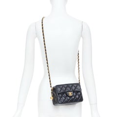 CHANEL 1990 Vintage black caviar quilted leather CC turnlock mini camera bag