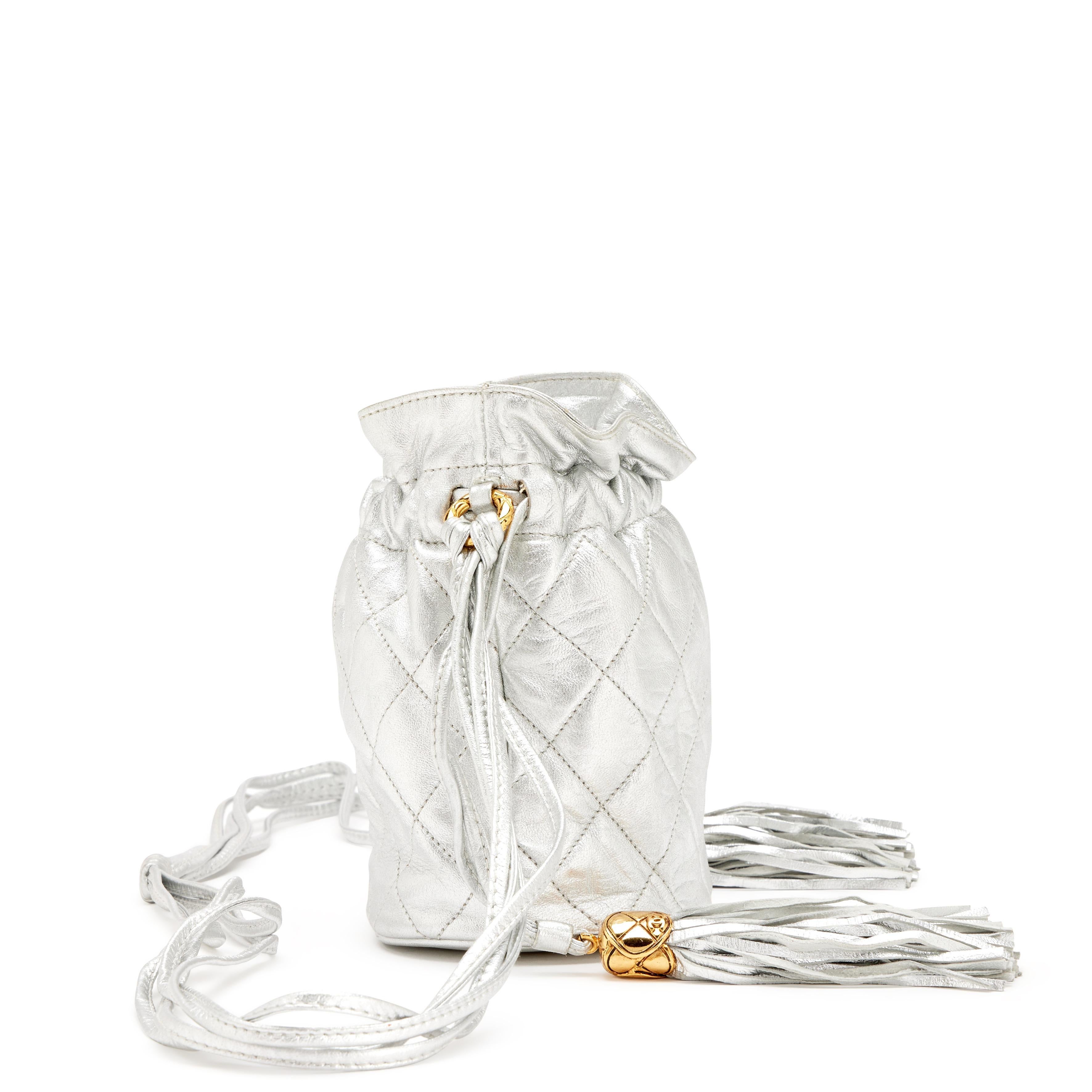 Chanel 1990 Vintage Metallic Silver Quilted Mini Lambskin Drawstring Tassel Bag For Sale 1