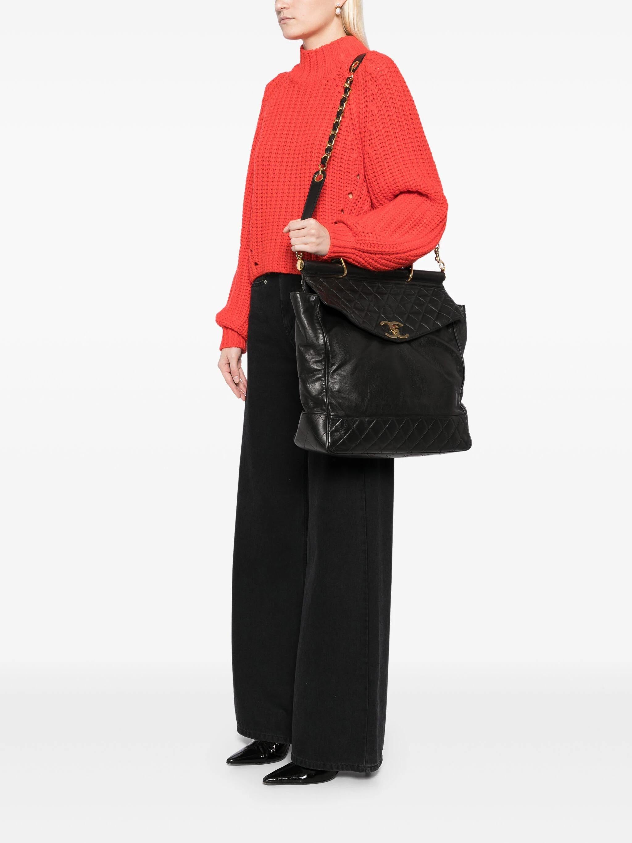Chanel 1990 Vintage Top Handle Briefcase Large Work Travel Crossbody Bag 

Year: 1989-1991

Gold hardware
Large CC turnlock 
Leather quilted stitching and smooth calfskin leather exterior
Interior button and hole added closure
Black Calfskin Leather