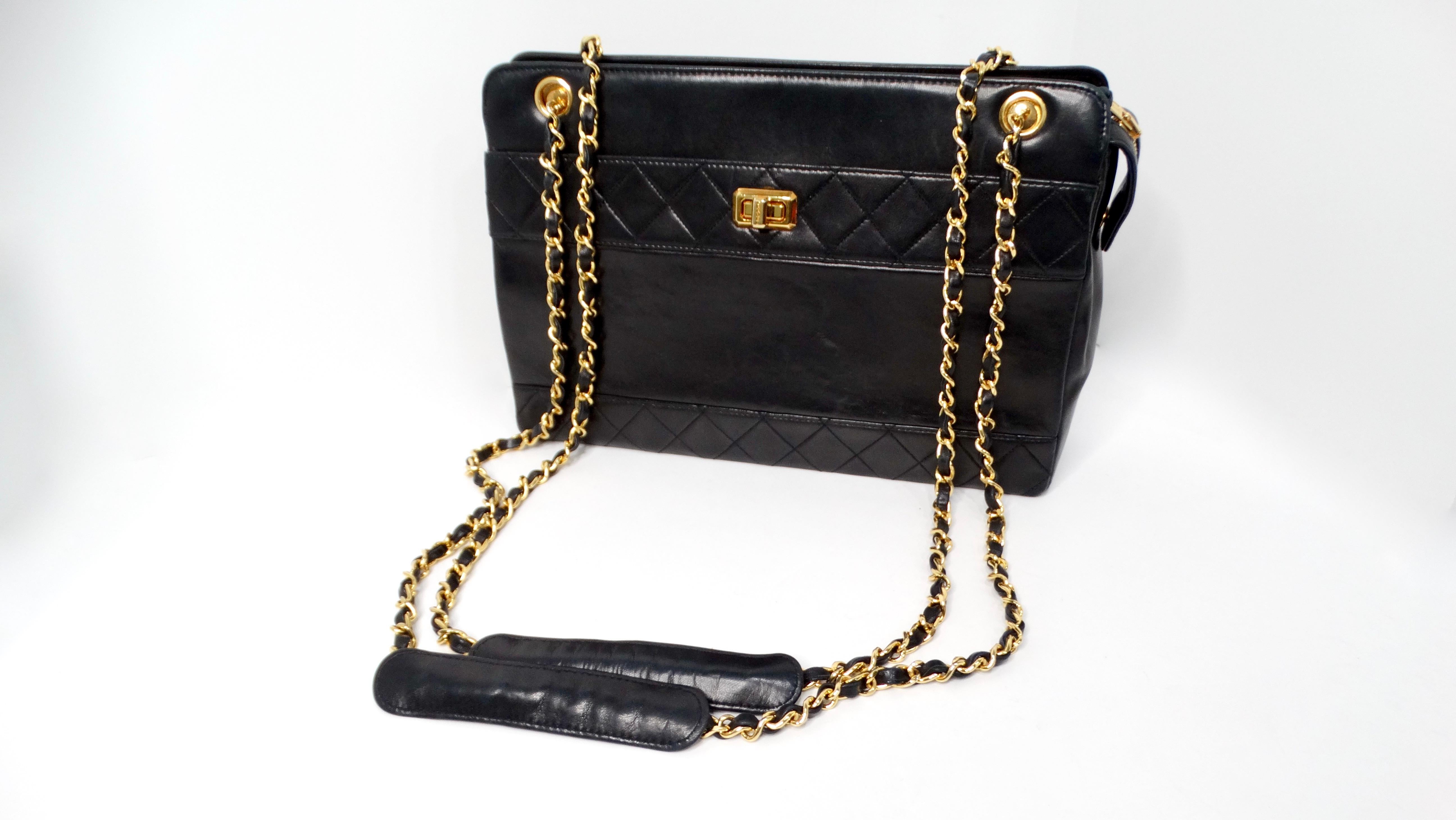 The Chanel 1990s Black Lambskin Quilted Messenger Shoulder Bag is a stunning representation of classic Chanel elegance. Crafted from supple lambskin leather, this iconic bag features a luxurious quilted design, complemented by striking yellow