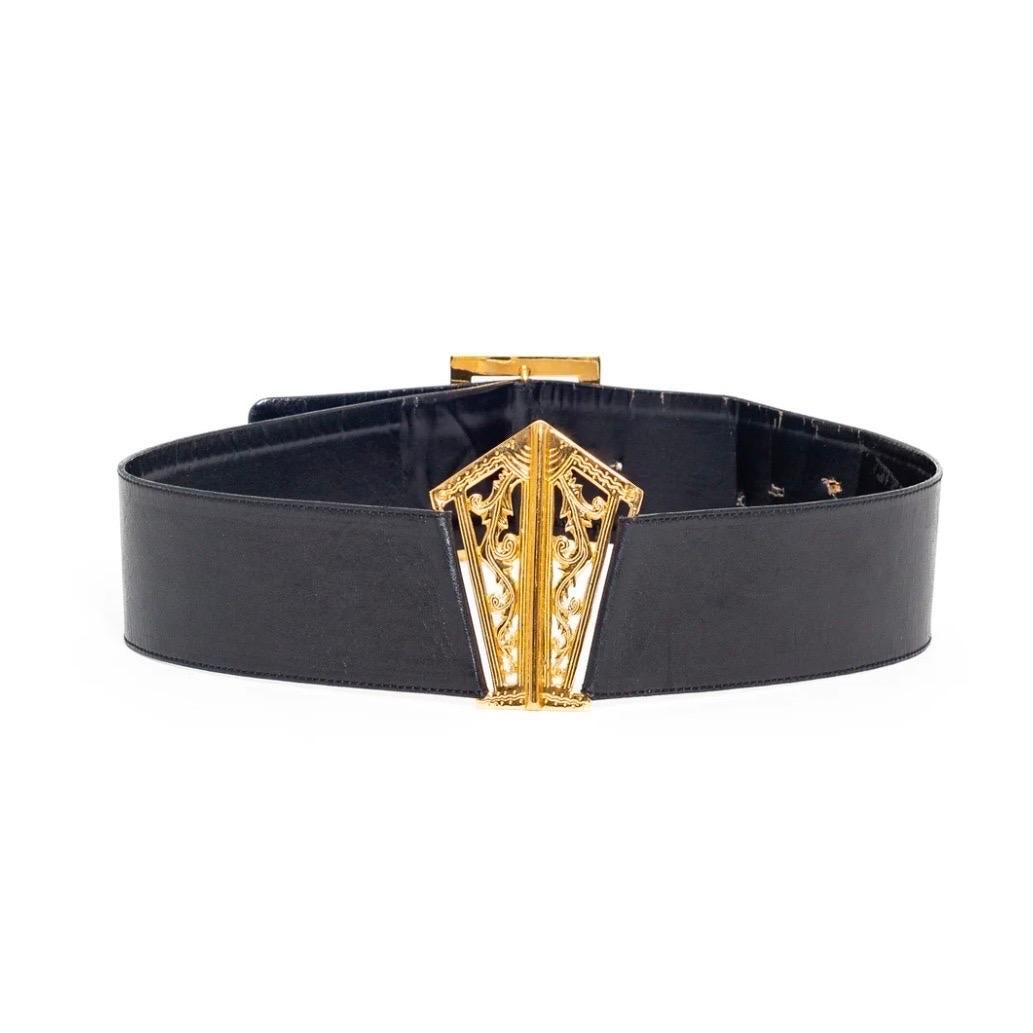Chanel 1990s Black Leather 24k Gold Plated Filigree Belt

Vintage; 1990s
Black
24k gold-plated hardware
Filigree centerpiece 
Buckles in back
Made in France
Good vintage pre-owned condition; functional with few visible flaws facing outward, however,