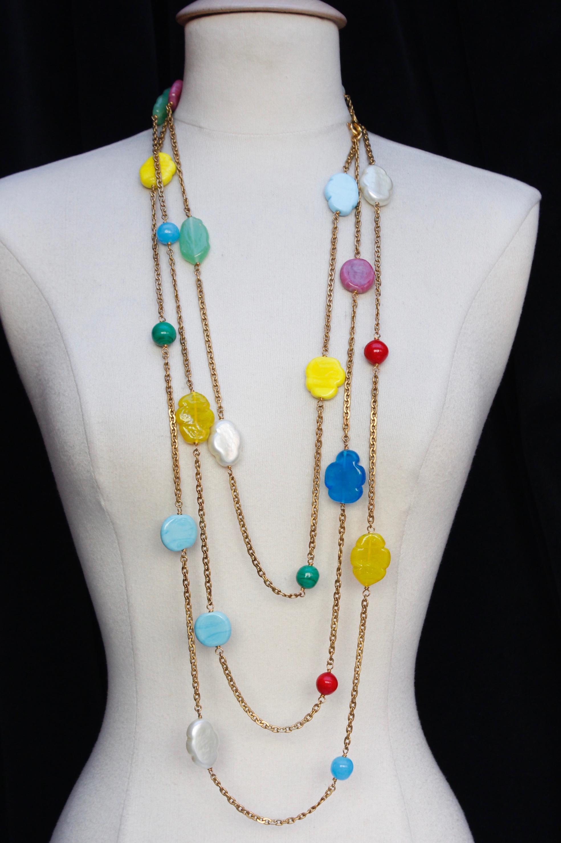 CHANEL (Made in France) Beautiful necklace comprised of a gilted metal chain and adorned by glass paste beads and glass paste cloud-shaped elements. Elements are made with bright colours as blue, pink, green, red, yellow and white.

From 1990s