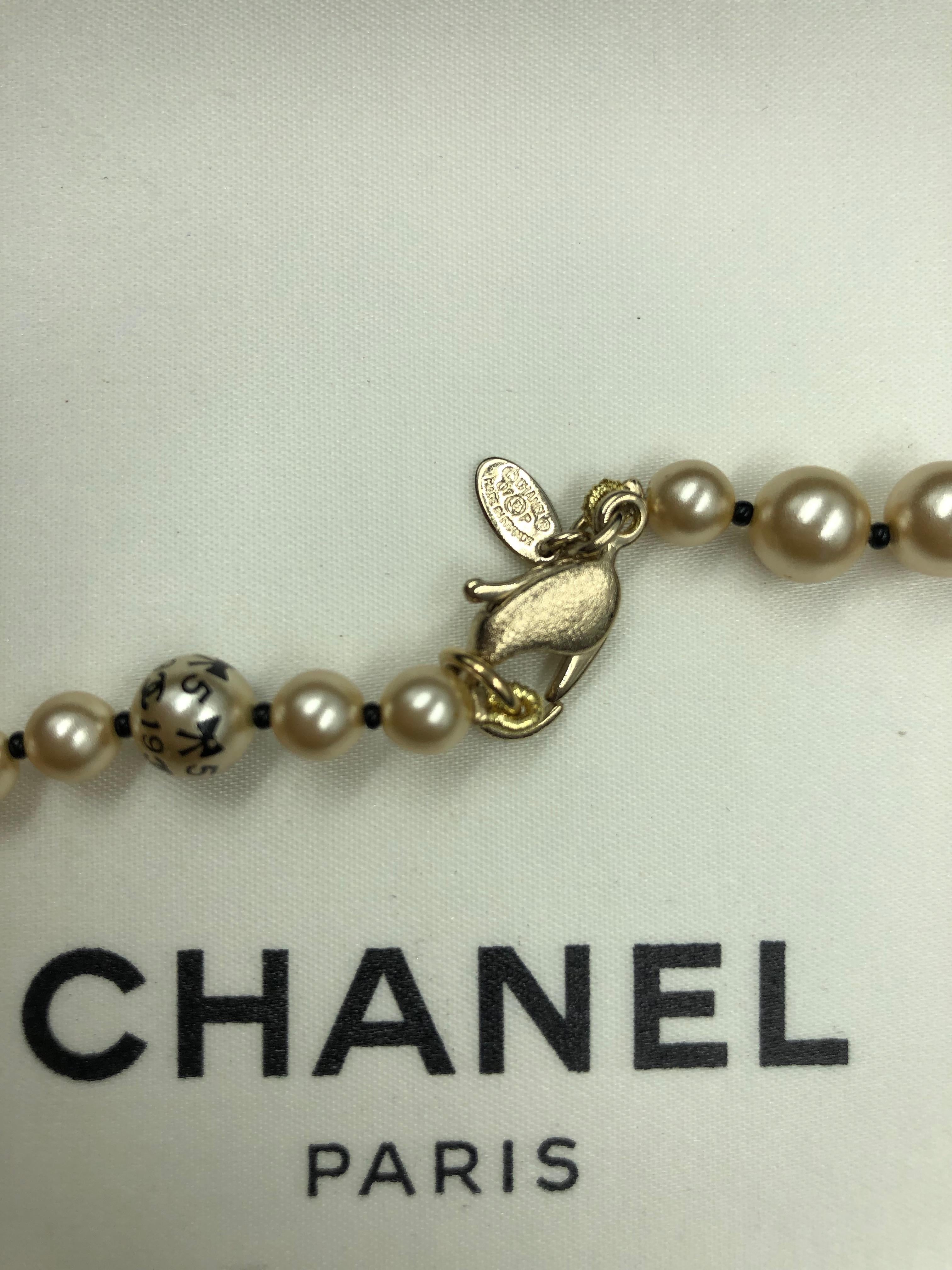 Chanel 1990's Faux Pearls with Coco Chanel Print on Strand In Good Condition In Los Angeles, CA