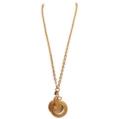 CHANEL 1990s Gilted metal chain necklace with magnifying glass and coin pendant