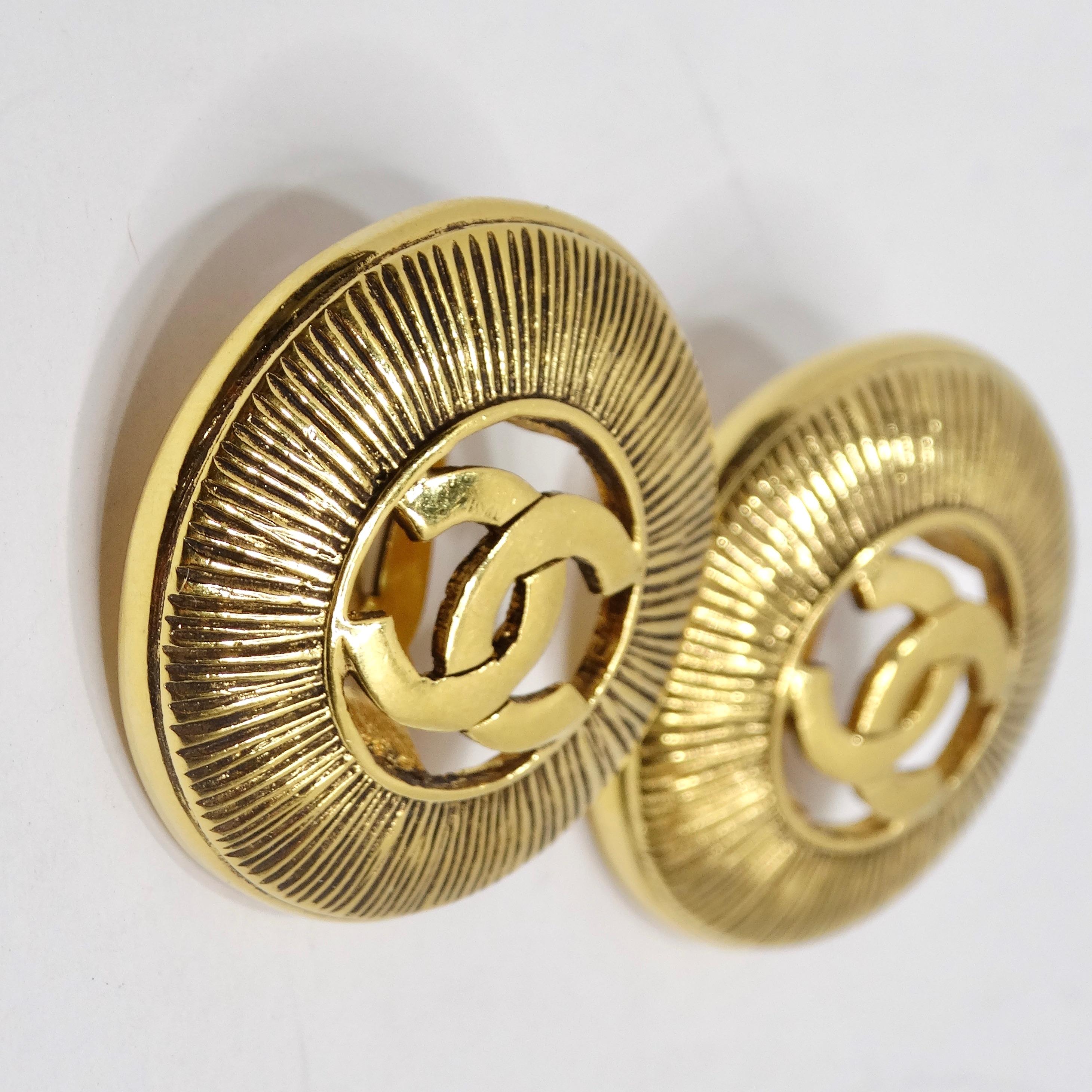 Chanel 1990s Gold Tone CC Starburst Earrings In Excellent Condition For Sale In Scottsdale, AZ