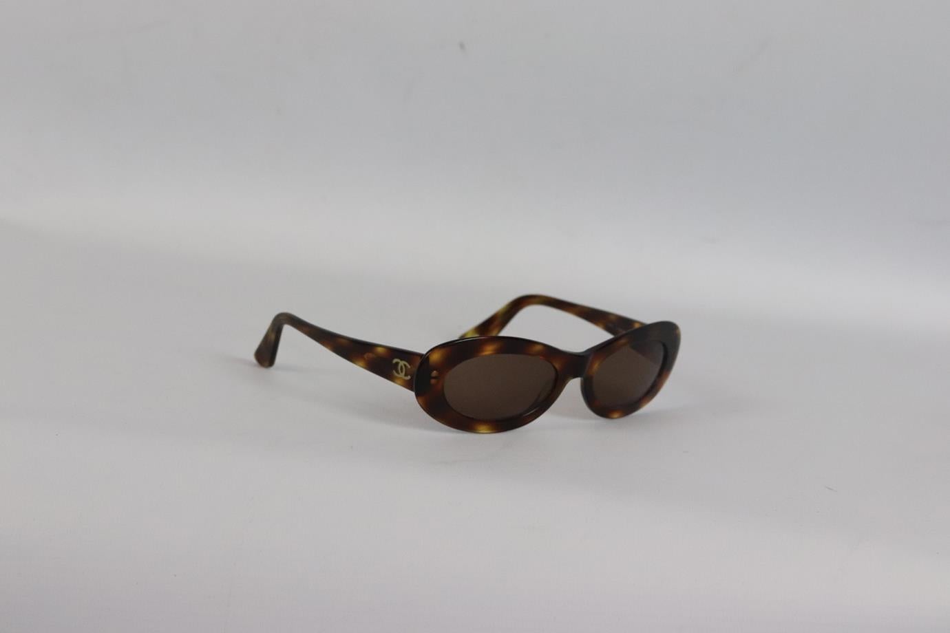 Chanel 1990's vintage oval frame tortoiseshell acetate sunglasses. Brown. Comes with case. Style code: 5007 c502/93. Lens Size: 52 mm. Arm Size: 135 mm. Bridge Size: 19 mm. Fair condition - Wear consistent with age. Signs of wear throughout.