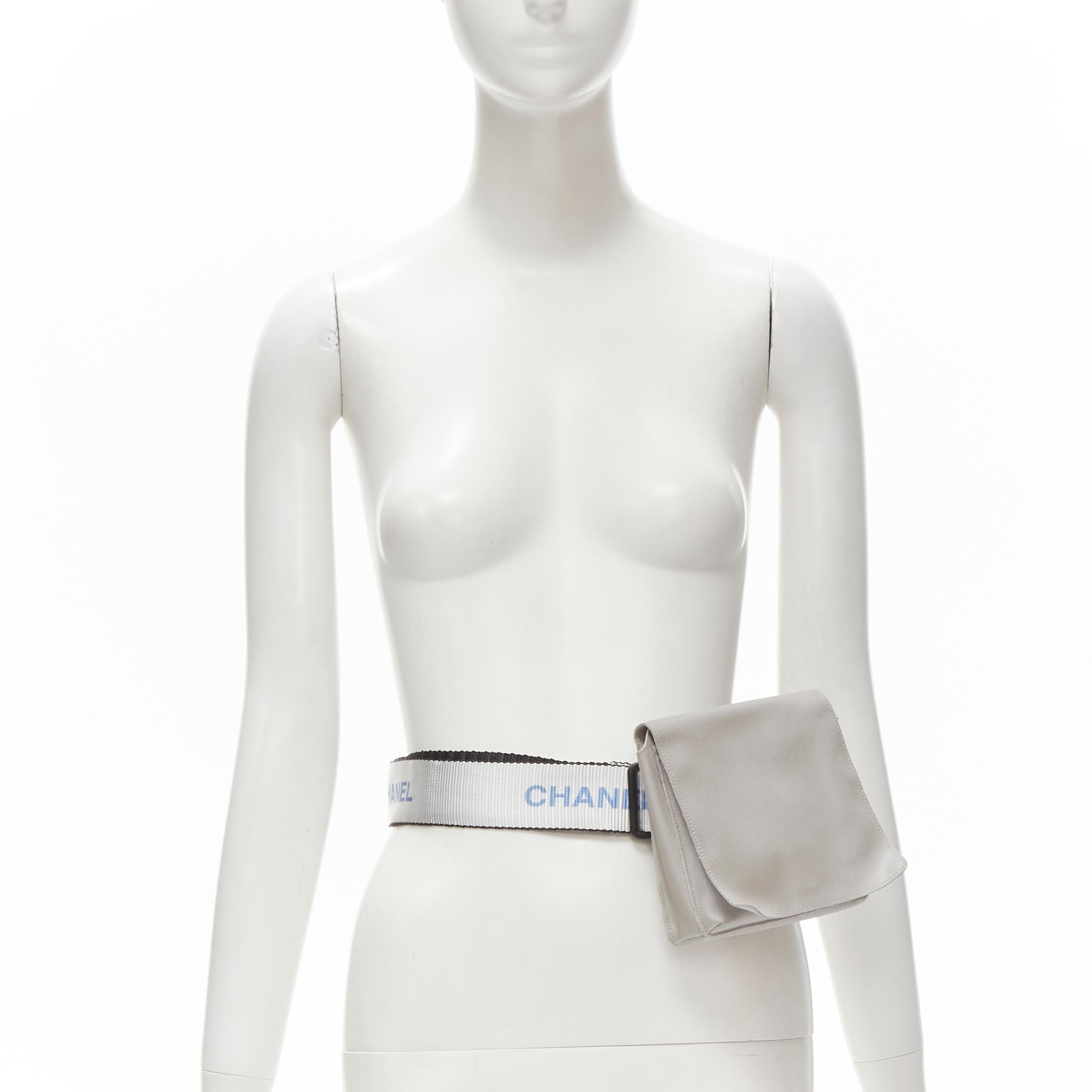 CHANEL 1990's Vintage silver nylon logo strap CC buckle square flap waist bag 
Reference: ANWU/A00038 
Brand: Chanel
Designer: Karl Lagerfeld 
Model: Nylon 
Collection: 1997-1999 
Material: Nylon 
Color: Silver 
Pattern: Solid
Closure: Buckle 
Extra