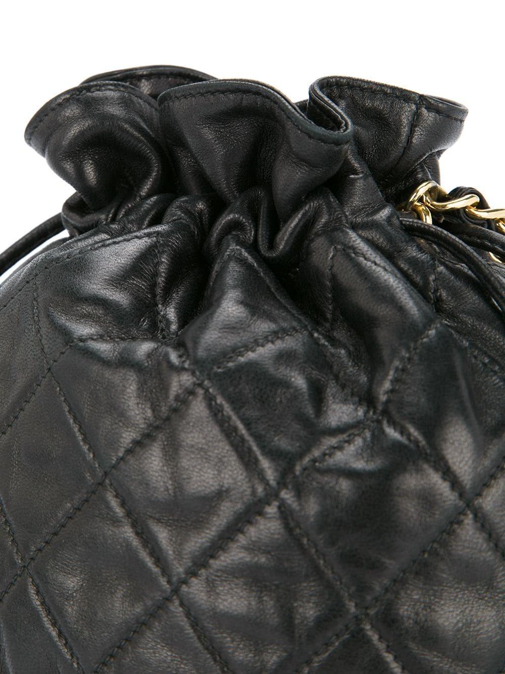 Women's or Men's Chanel 1991 Vintage Drawstring Black Lambskin Mini Bucket Crossbody Shoulder Bag For Sale