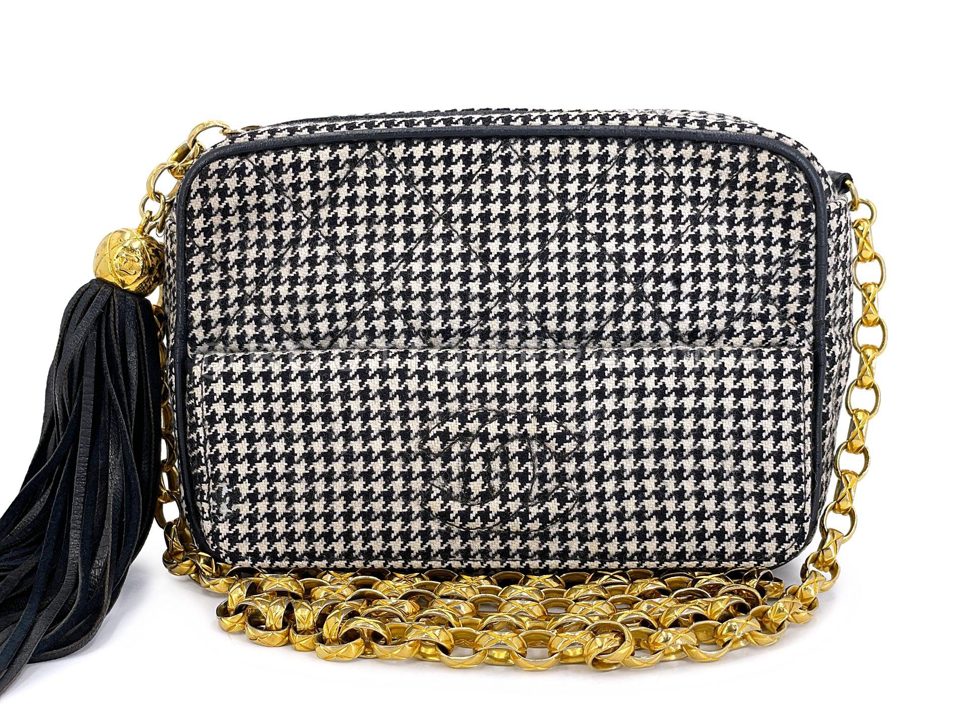 Store item: 68256
This Chanel 1991 Vintage Mini Houndstooth Camera Bag 24k GHW Black White is a one-of-a-kind find for the collector's closet. 

For 20 years, Boutique Patina has specialized in sourcing and curating the most pristine vintage and