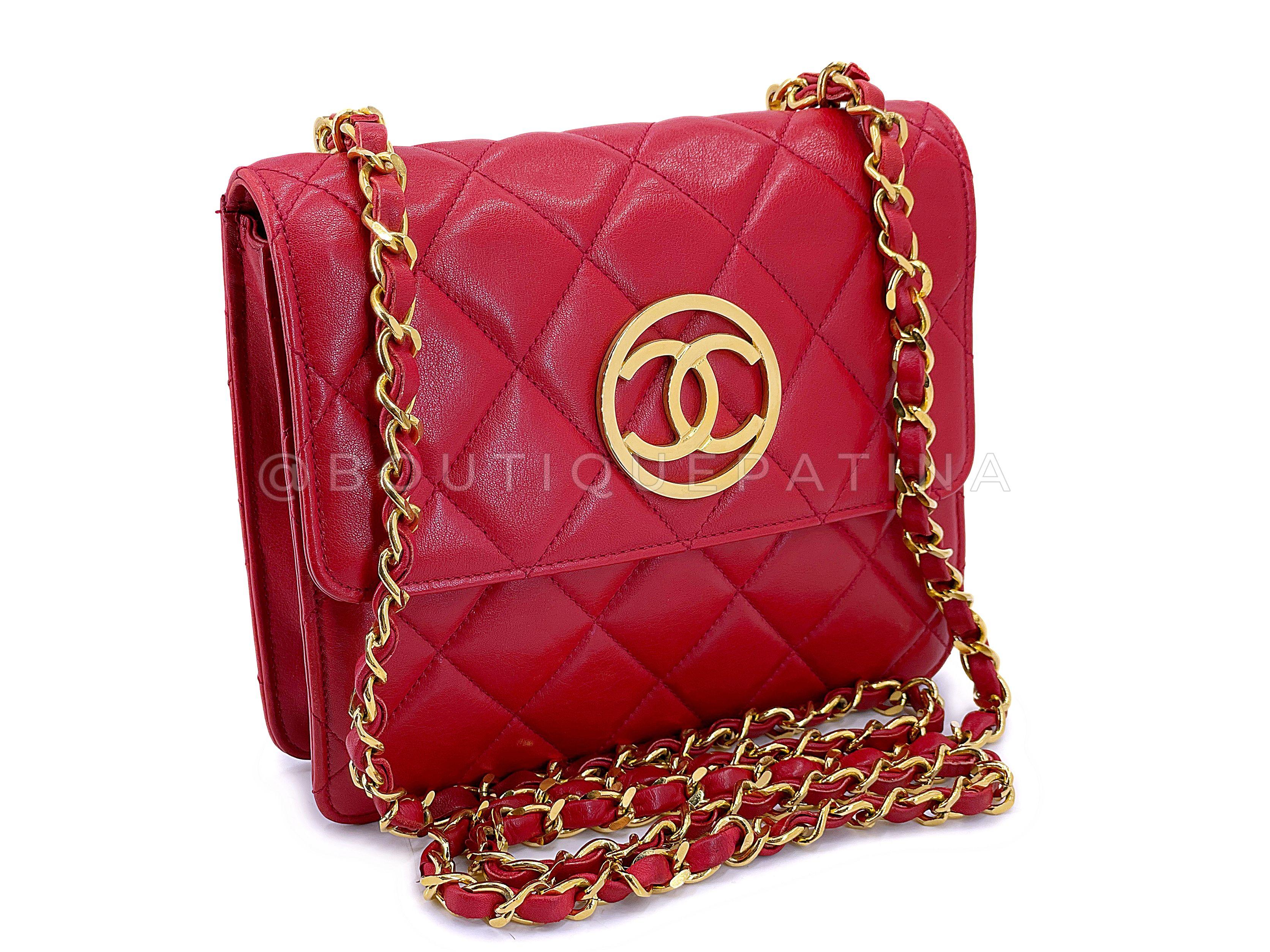 Store item: 67768
This Chanel 1991 Vintage Red Encircled CC Mini Flap Bag 24k GHW is a perfect crossbody in the size of a classic square mini flap.

A 24k gold plated encircled CC logo on front, quilted red lambskin leather back panels, back