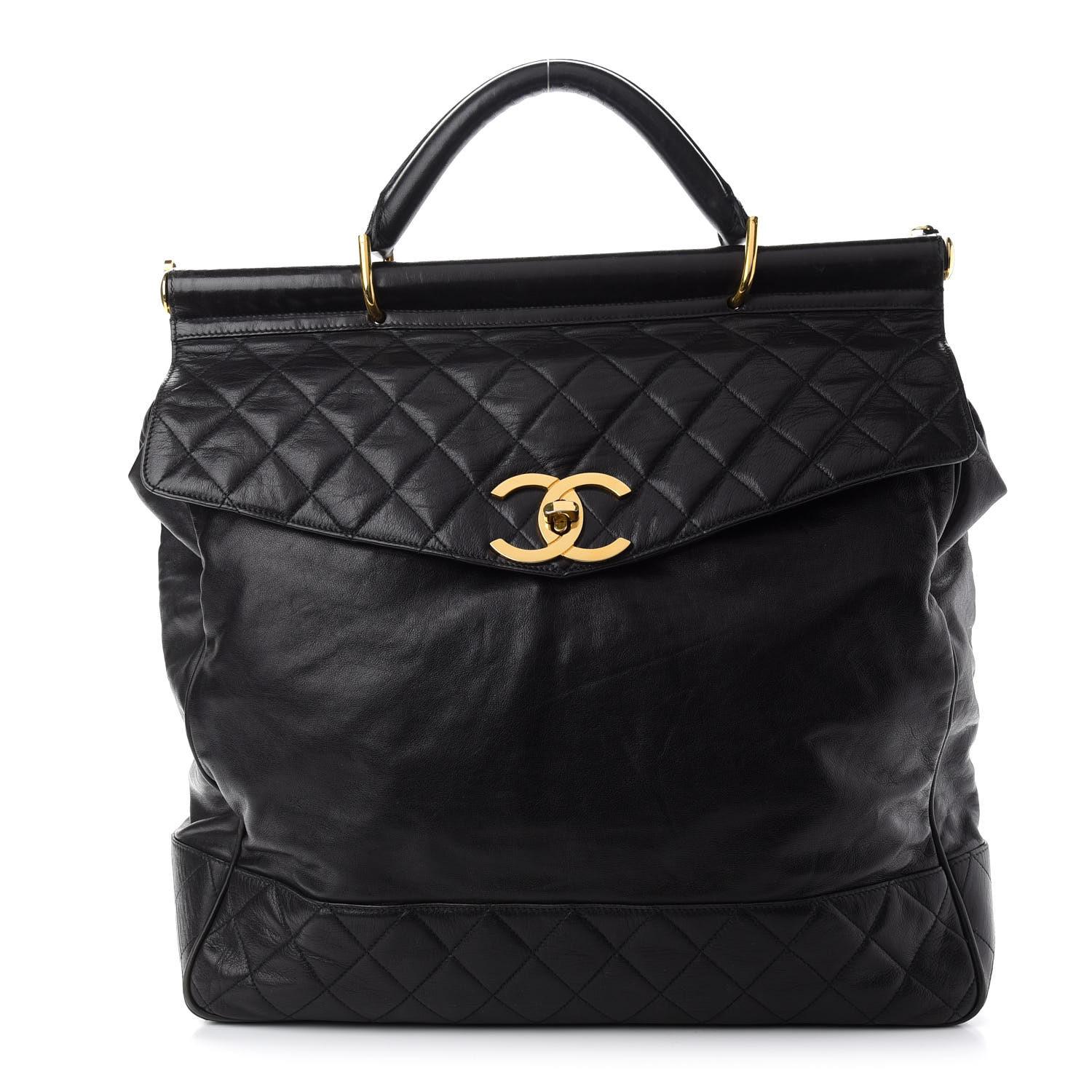 Chanel 1991 Vintage Top Handle Briefcase Large Work Travel Crossbody Bag 

Year: 1989-1991

Gold hardware
Large CC turnlock 
Leather quilted stitching and smooth calfskin leather exterior
Interior button and hole added closure
Black Calfskin Leather