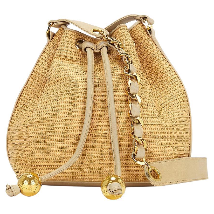 Chanel 1992 Vintage Raffia Straw Jute Gold CC Balls Drawstring Bucket Bag For Sale