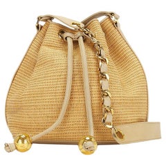 Chanel 1992 Vintage Raffia Straw Jute Gold CC Balls Drawstring Bucket Bag