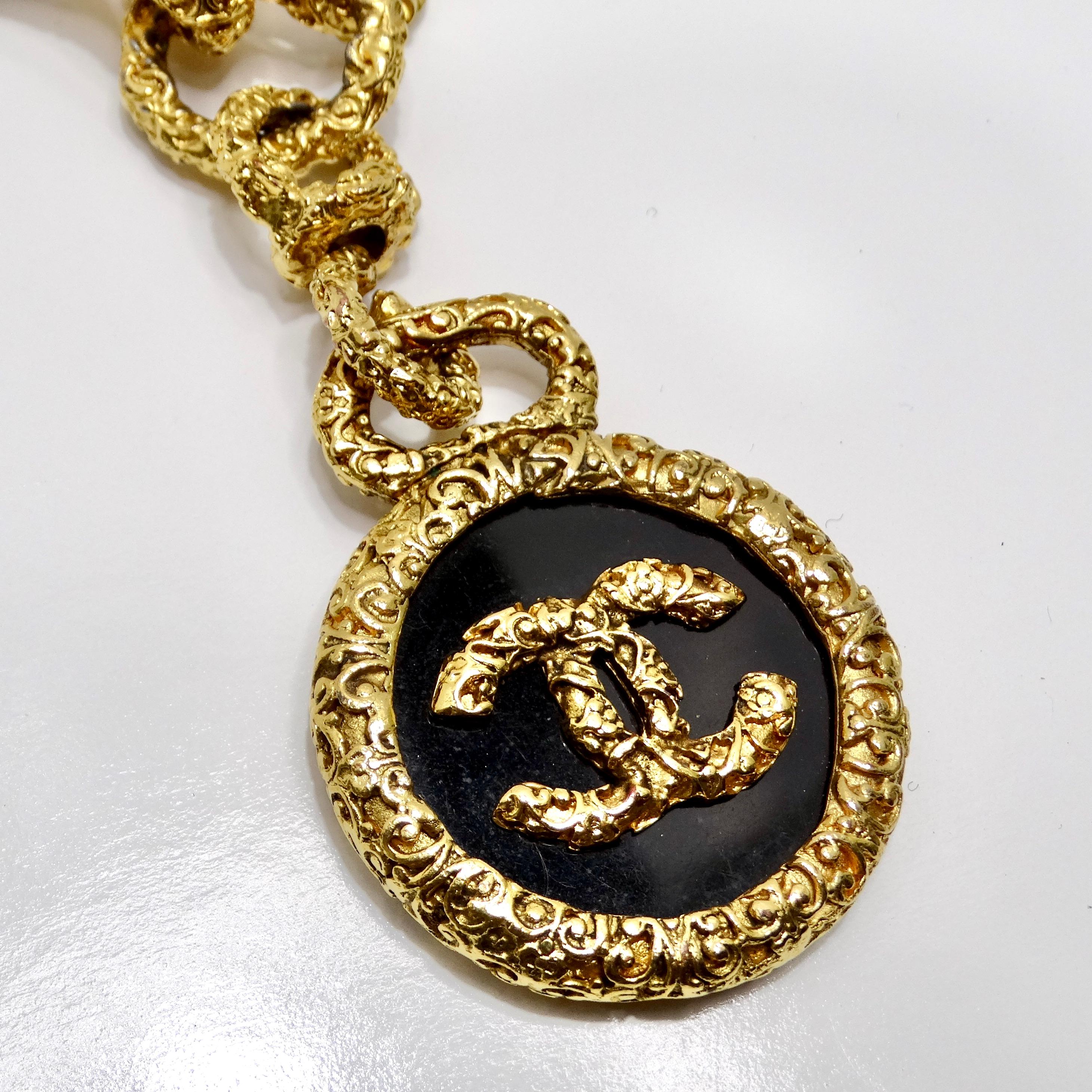 Introducing the exquisite Chanel 1993 Gold Tone Black CC Medallion Florentine Necklace, a timeless treasure that exudes luxury and sophistication. Crafted with meticulous attention to detail, this stunning necklace is sure to elevate any ensemble