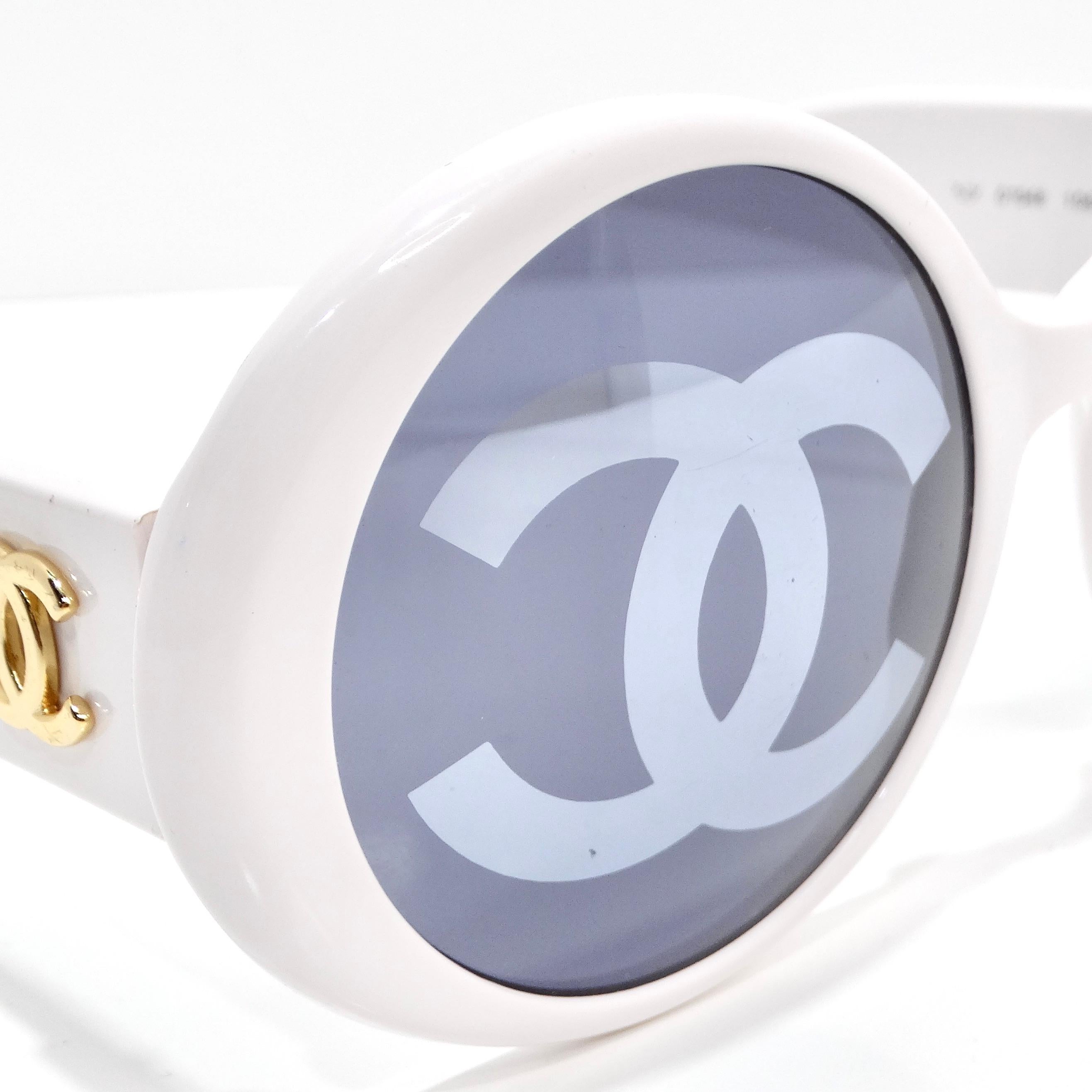 Indulge in a piece of fashion history with the Chanel 1993 White CC Logo Round Lens Sunglasses, a rare and coveted find from Chanel's iconic 1993 runway show. These show-stopping sunglasses boast round lenses that exude timeless elegance, while the