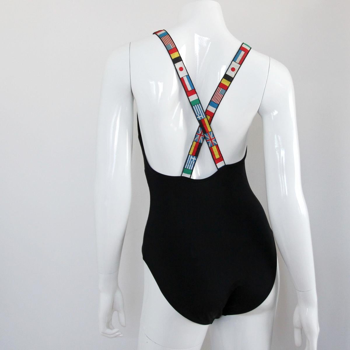 CHANEL 
 
1994. Iconic Chanel swimming costume with flag straps and large embroidered CC logo. By Karl Lagerfeld for Chanel. From the advertising AD with Claudia Schiffer.

Also perfect to wear as a top (see photos).

Buy Now Or Cry Later!
Get the