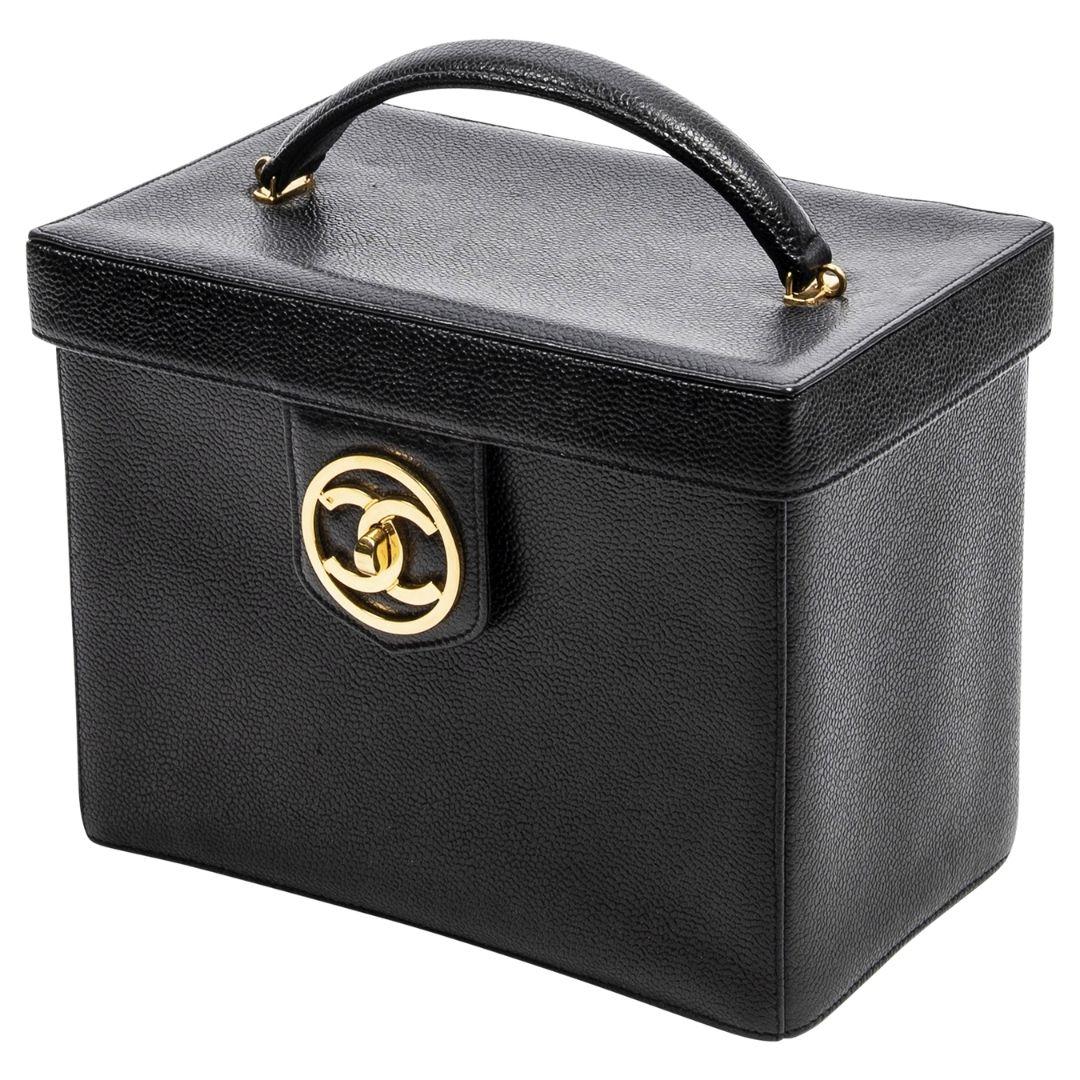 Designed in 1925 by Coco Chanel herself! This extremely rare 1994 treasure signifies the moment the interlocking CC logo became Chanel's signature. This beauty is crafted in black caviar leather, gold-tone hardware, a single rounded top handle,