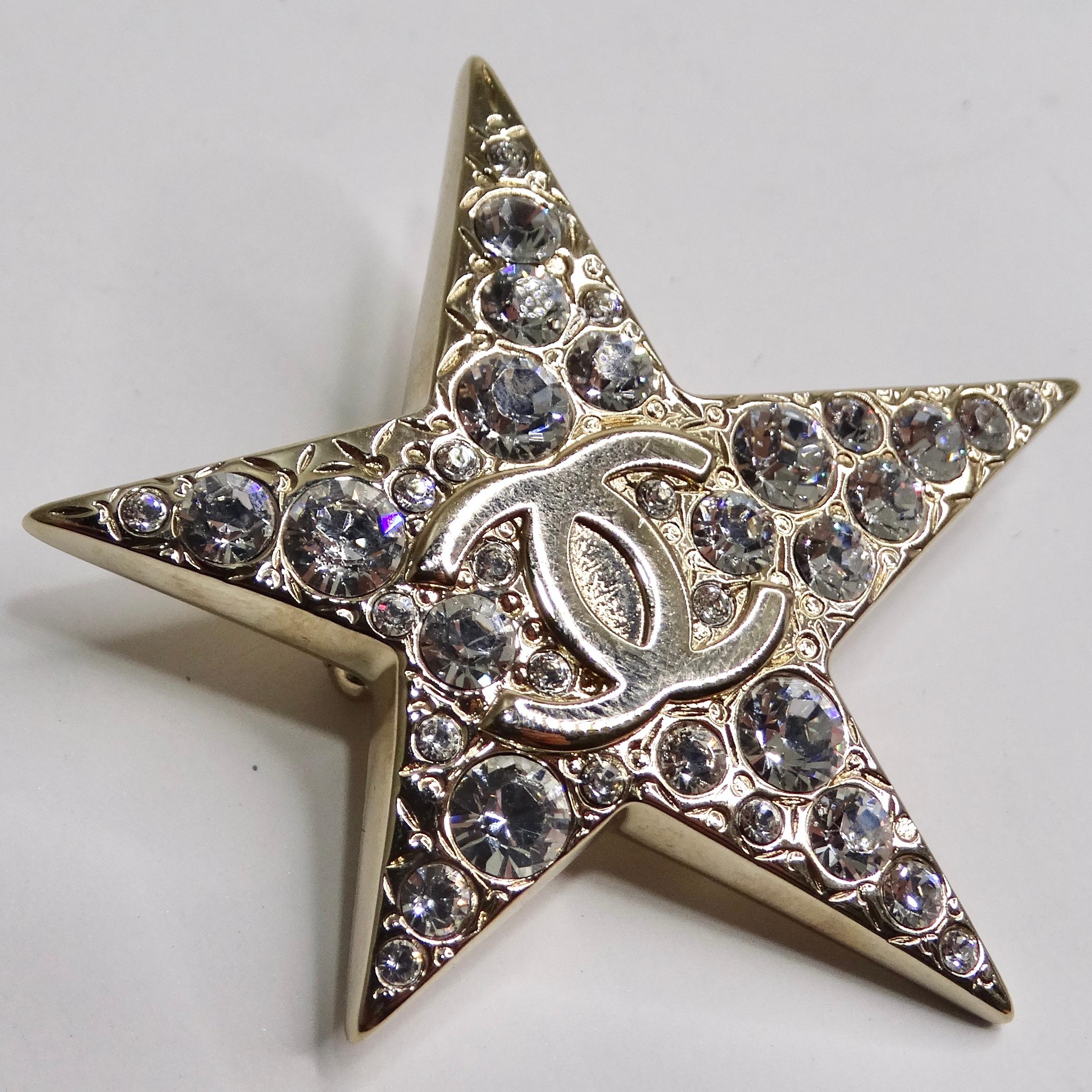 Introducing the Chanel 1994 Comet Brooch - A Dazzling Starburst of Elegance and Vintage Glamour! This vintage Chanel brooch is a testament to the brand's timeless elegance and creativity. The star-shaped design showcases a stunning Chanel CC logo at