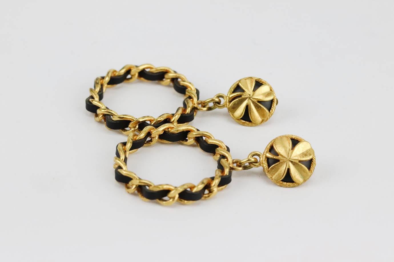 Chanel 1994 Vintage clover hoop Clip on earrings. Black and gold. Clip on fastening. Does not come with box or dustbag. Length: 2.5 in. Width: 1.5 in
