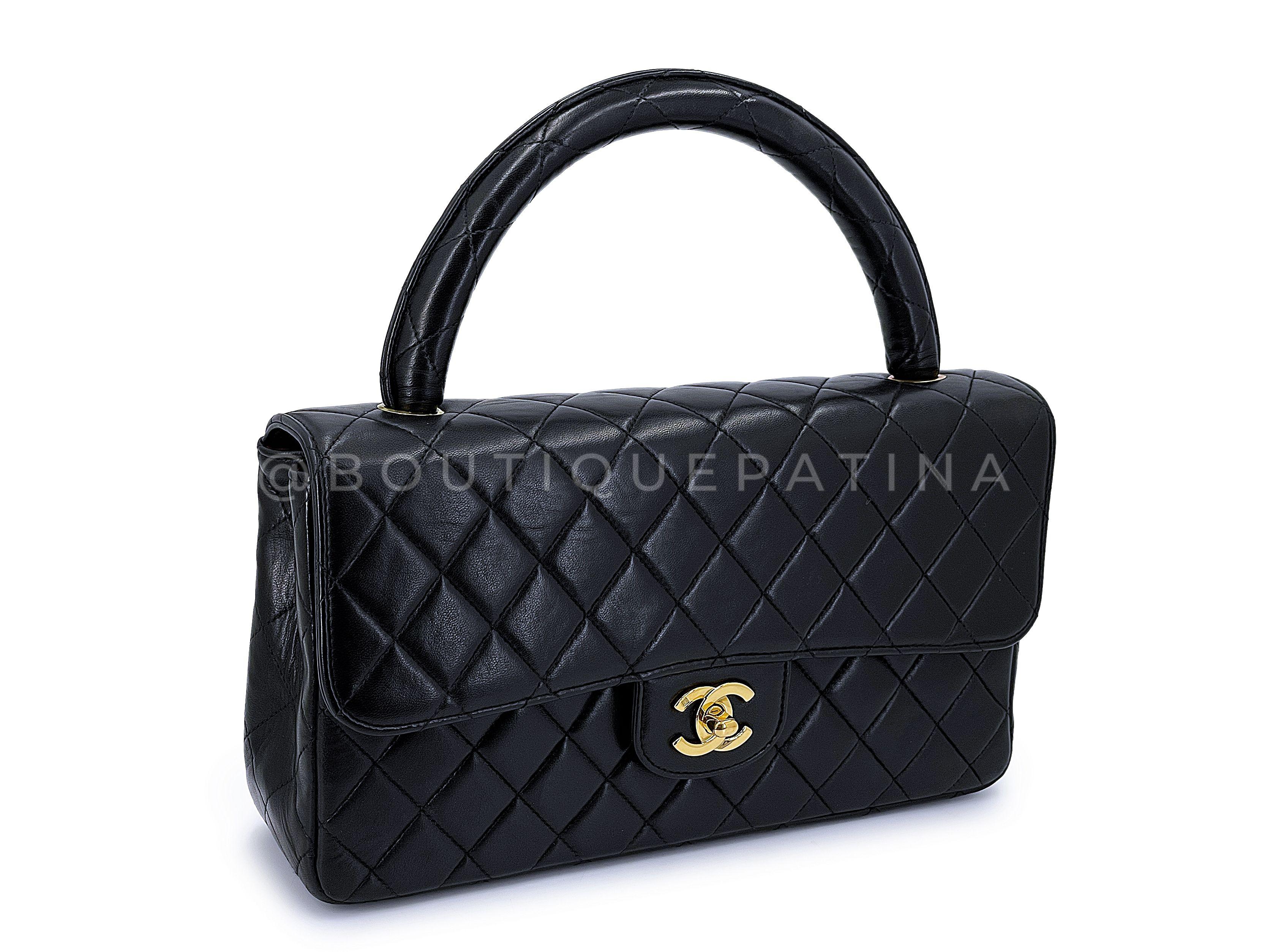 Store item: 66669
A super rare collectible is this model - a medium quilted flap base with a rolled quilted leather handle. A collector's essential treasure is this hard-to-find mother and child vintage Chanel kelly set with golden carabiner.

If