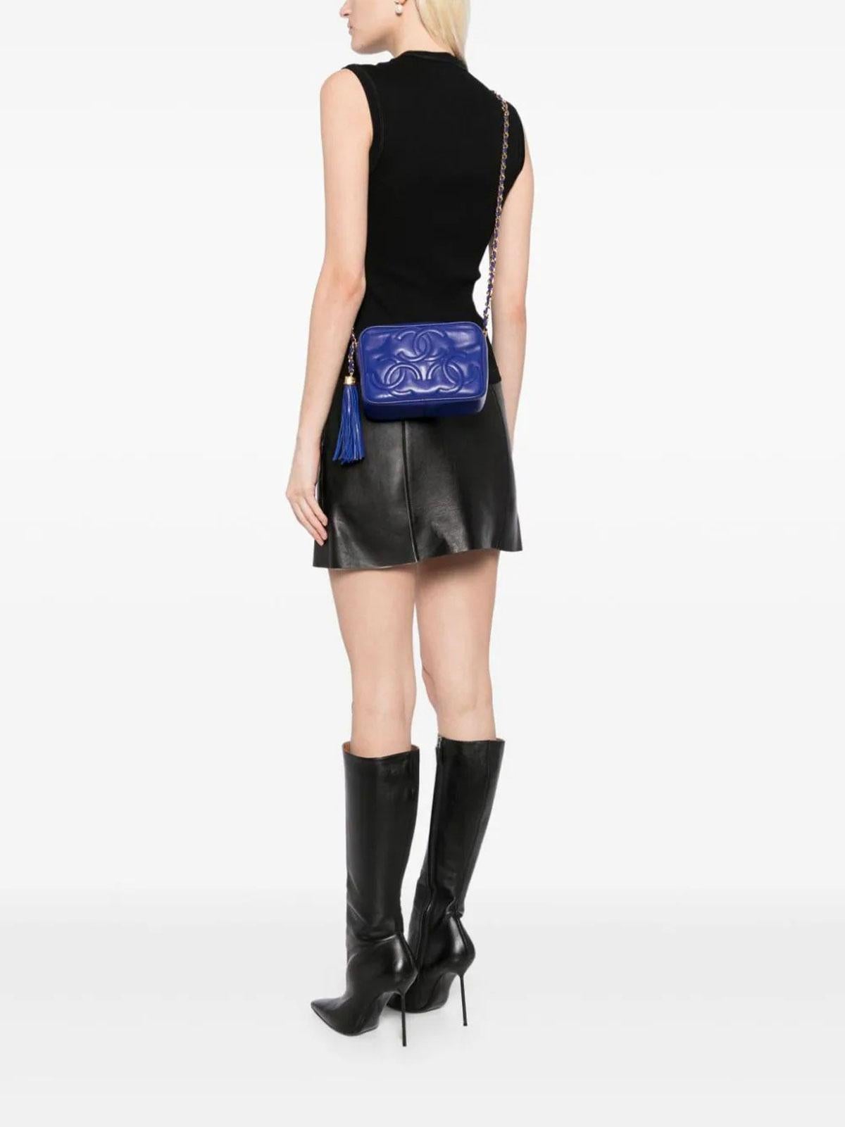 Chanel Rare Vintage 90s Royal Blue Bleu Roi Lambskin Triple CC Mini Tassel Crossbody Shoulder Bag 

Year: 1994-1996

Gold hardware
Royal blue lambskin leather
Classic interwoven chain strap 
Iconic overlapping CC logo stitching 
Large tassel and zip
