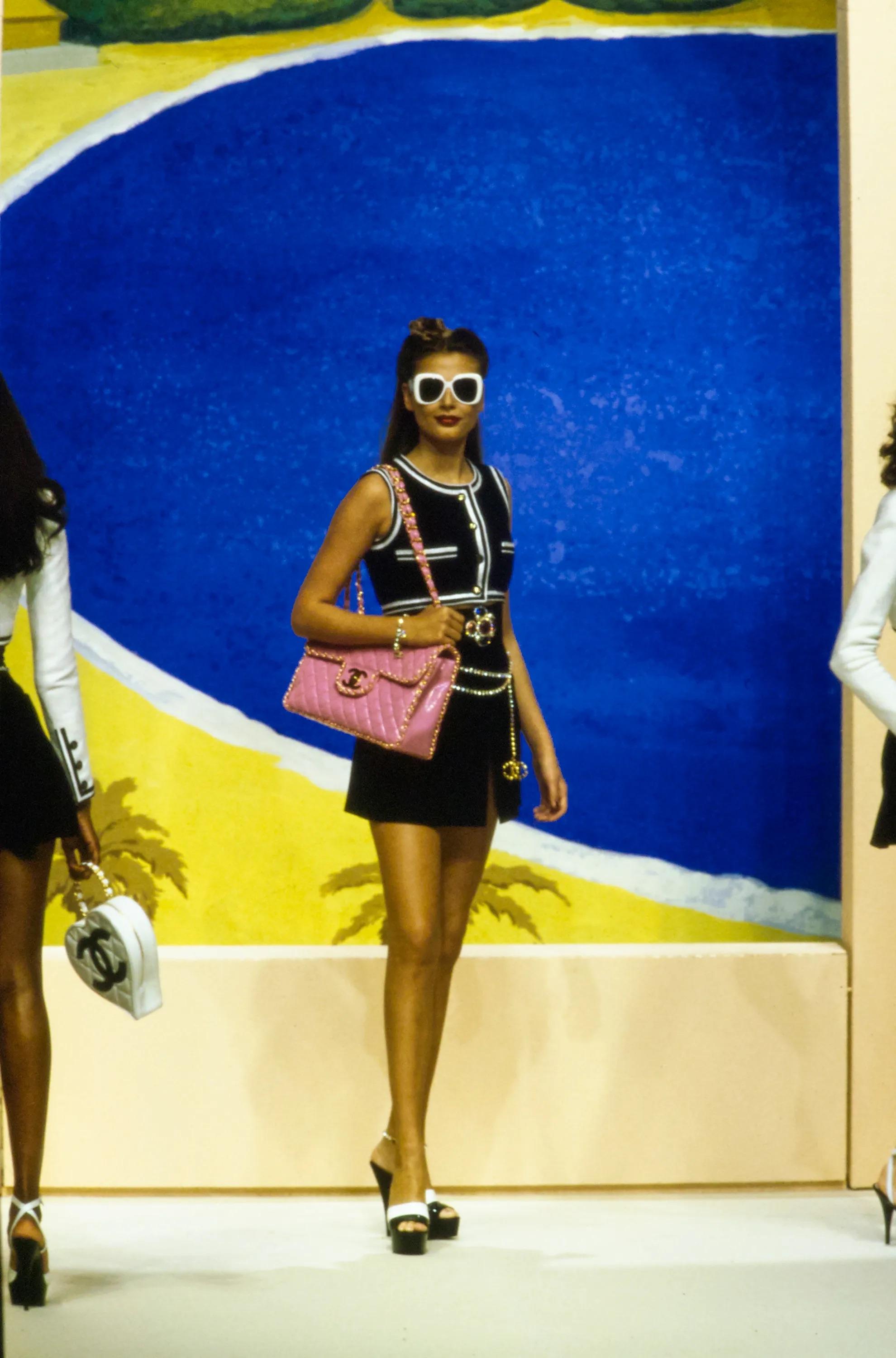 An iconic and highly sought-after piece from Chanel’s Spring-Summer 1995 (95P) Act II collection, this Jumbo XL Chain Around Single Flap bag is a true collector’s treasure. Designed as part of Chanel’s sought-after Barbie collection, this handbag is