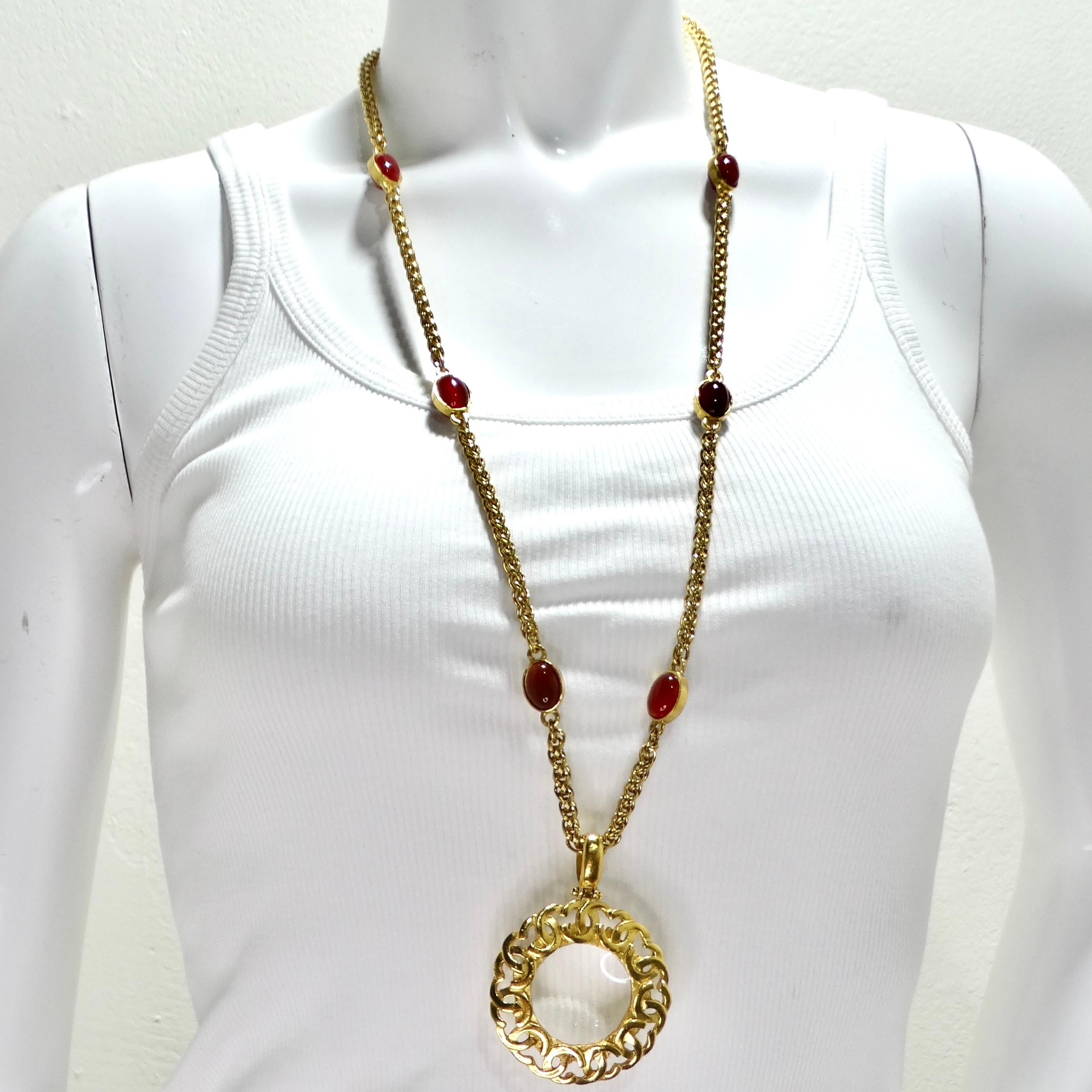 Indulge in the timeless elegance of Chanel with this exquisite Chanel 1995 Gold Tone Gripoix Glass Pendant Necklace. This rare vintage piece is a true treasure, showcasing the iconic craftsmanship and sophistication that Chanel is renowned