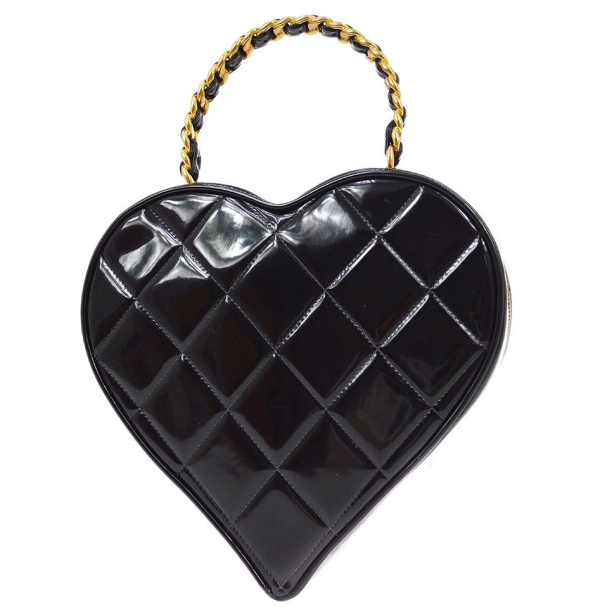 Chanel Jumbo CC Heart Cosmetic Vanity Hard Bag Black Patent Leather

Additional information:
Material : Patent Leather
Color: Black, White
Pocket: Inside: Pocket*1
Accessories: Authenticity Seal(scuffed and minor peeled)
Size(Inch): W 9.1 