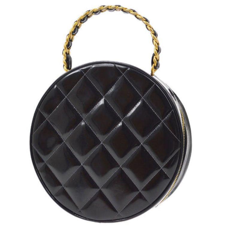 Chanel Round Cosmetic Chain Vanity Hand Bag Black

Additional information:
Material : Patent Leather
Color: Black, White 
Pocket : Outside: - , Inside: Pocket *1
Accessories : Authenticity Seal
Size(Inch) : W 8.7 x H 8.7 x D 2.8 