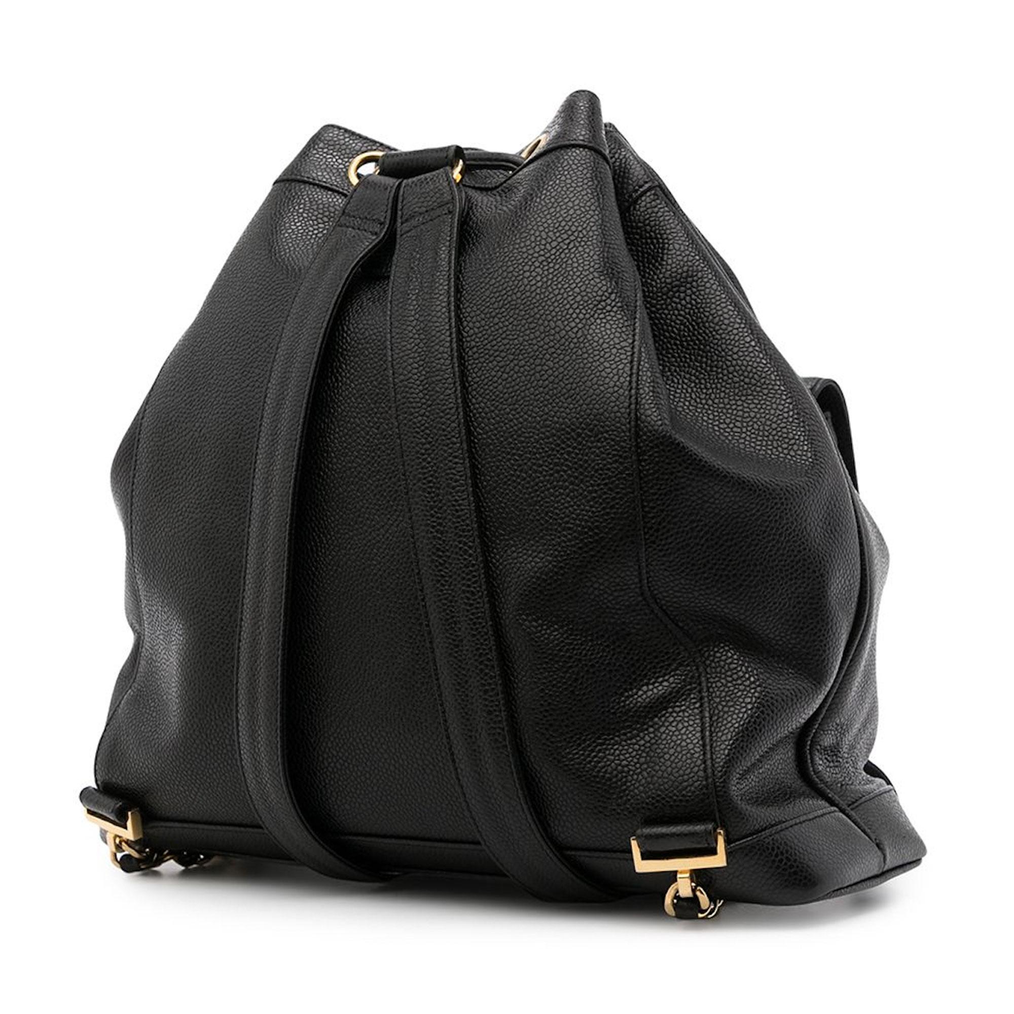 Classic Chanel caviar black backpack with front pocket and classic CC closure

1995 {VINTAGE 28 Years}
Gold hardware
Drawstring closure
Interior lambskin lining
Interior caviar zippered pouch
Flat bottom
Leather backpack straps with interwoven