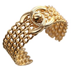 CHANEL 1996 P gilted metal twist lock cuff bracelet