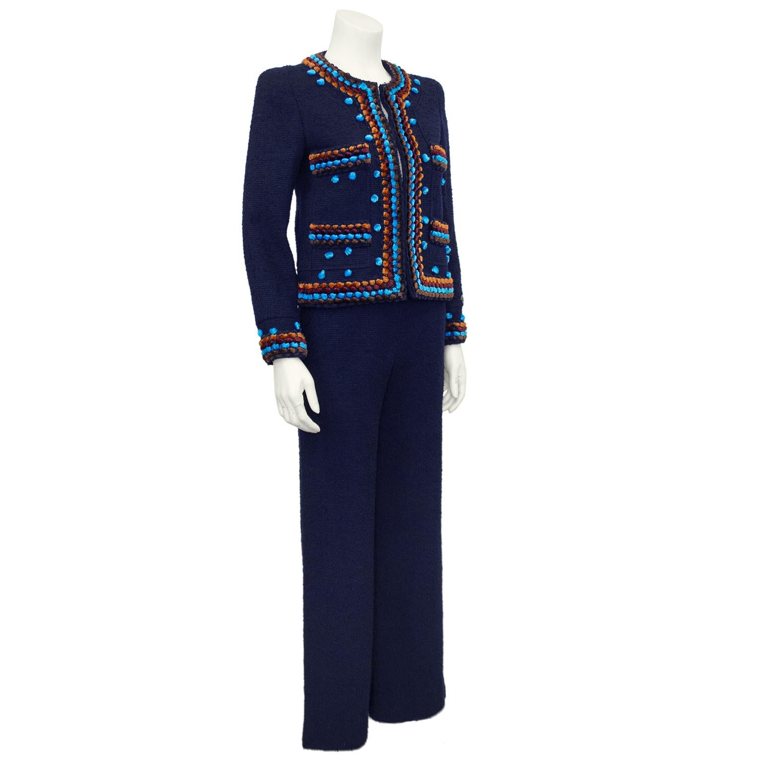 1997 Never worn Chanel Boutique navy pant suit. In excellent unused condition and currently on trend based on May 2022 Montecarlo Chanel runway show. Pant suits are back and this size 34 is perfect and timeless. Cropped, boxy jacket has tufts of