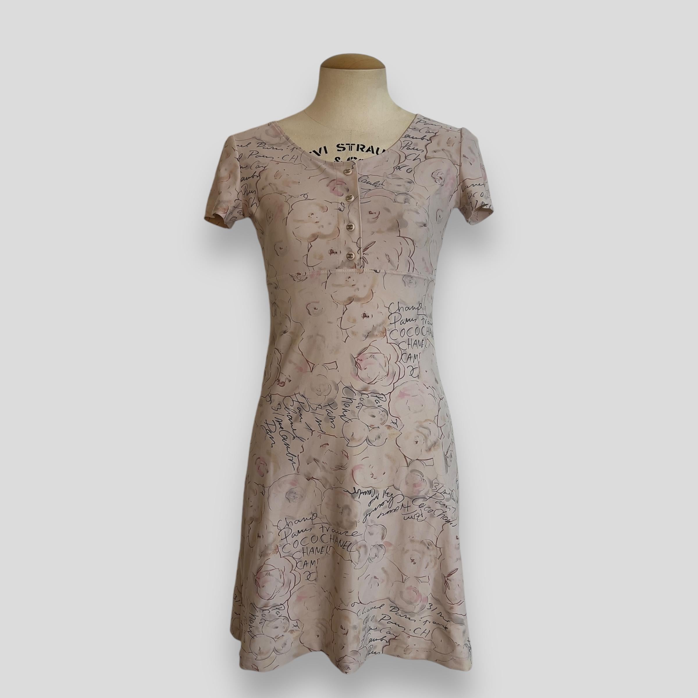 Piece Description: This rare and highly collectible dress from Chanel's 1998 Cruise Resort collection by Karl Lagerfeld effortlessly combines comfort and elegance. Crafted from a smooth, stretchy fabric in a slightly yellow-toned ivory, it features