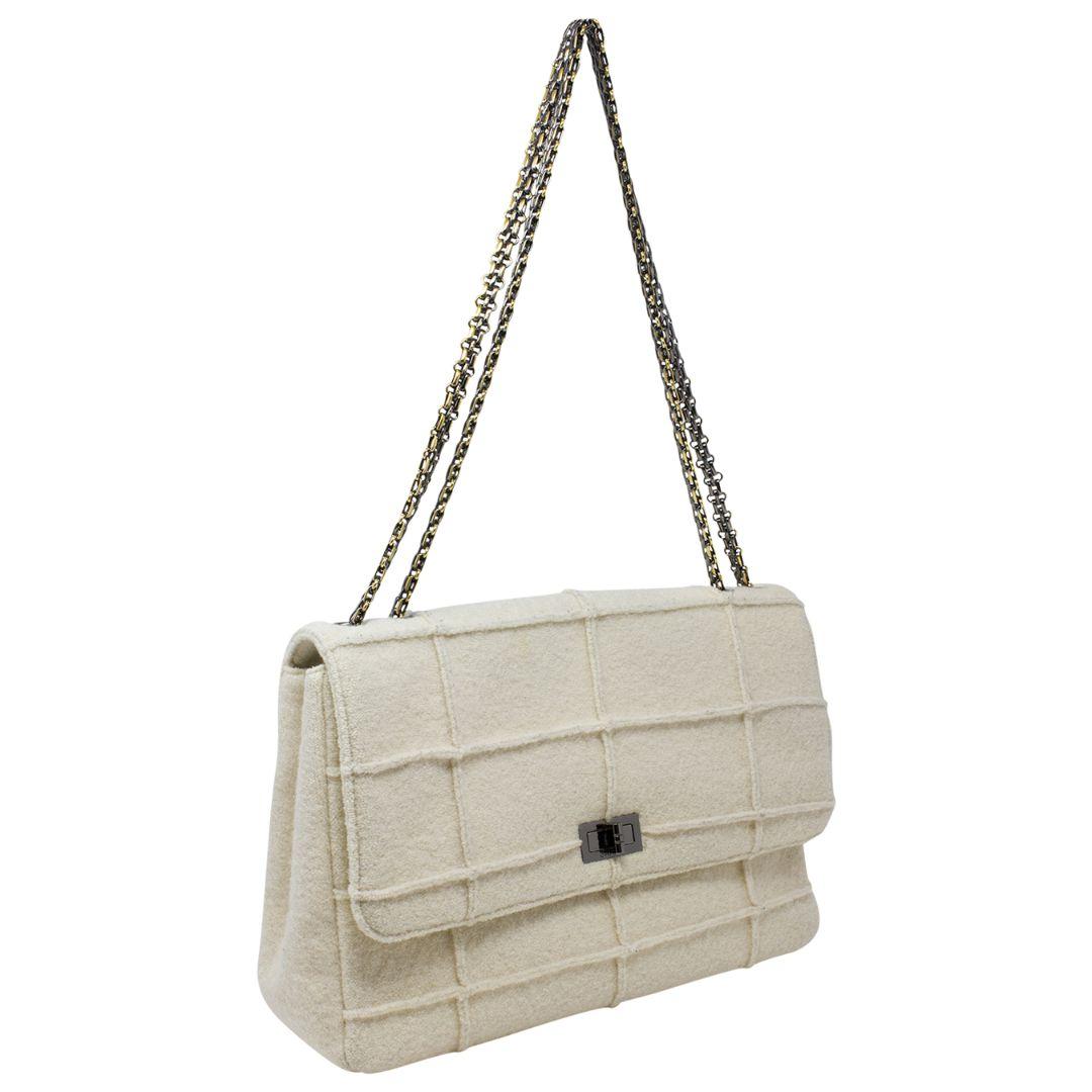 Stand out from the crowd with a limited edition jumbo Chanel designed by Karl Lagerfeld for Chanel!! This Chanel Reissue Mademoiselle Jumbo Bag from the Millennium Collection has the rare Chanel Identification tag used only in this iconic