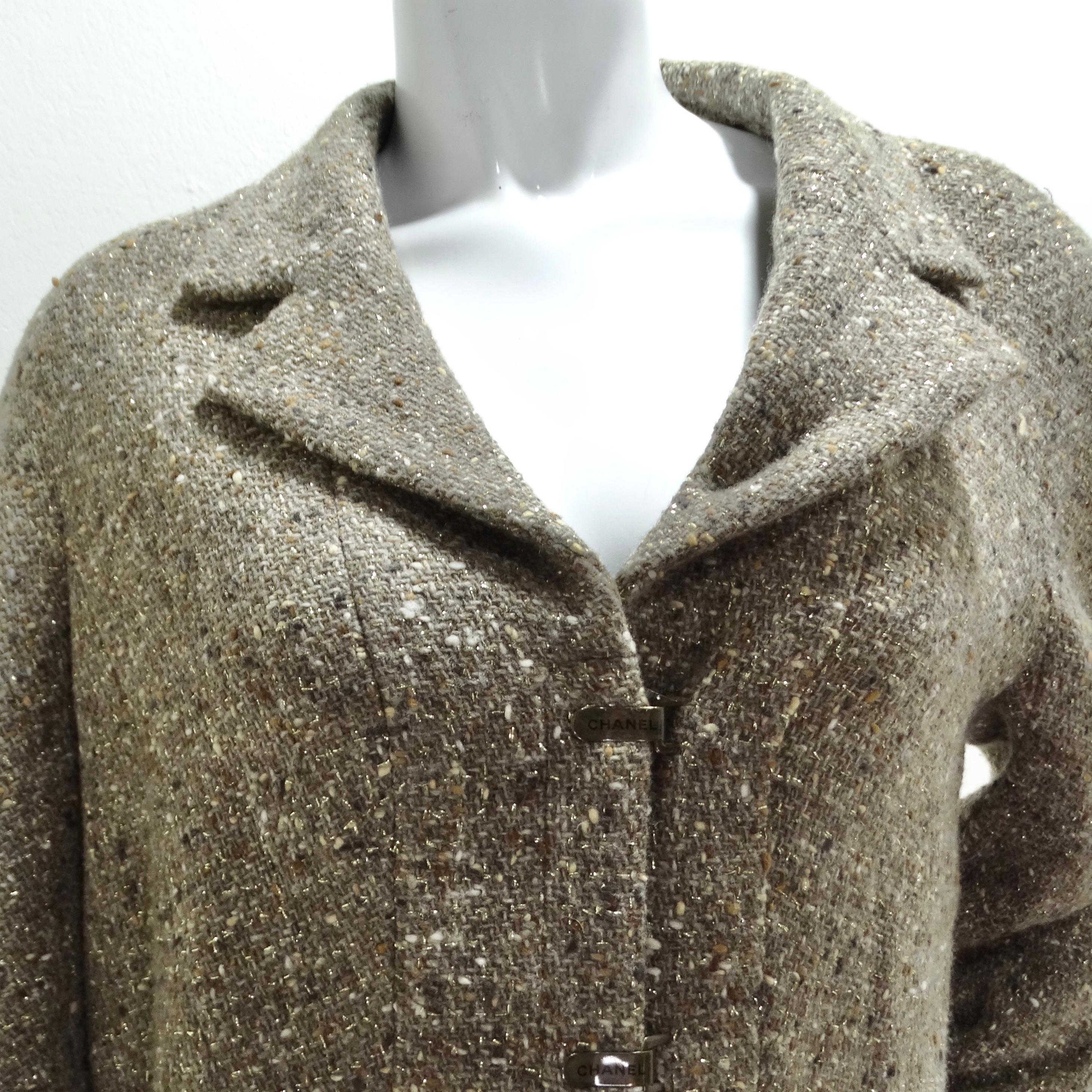 The Chanel 1999 Brown Tweed Blazer is a vintage piece that represents the timeless elegance and craftsmanship for which Chanel is renowned. This blazer, from the late 1990s, is crafted from classic brown tweed, a signature fabric that evokes a sense