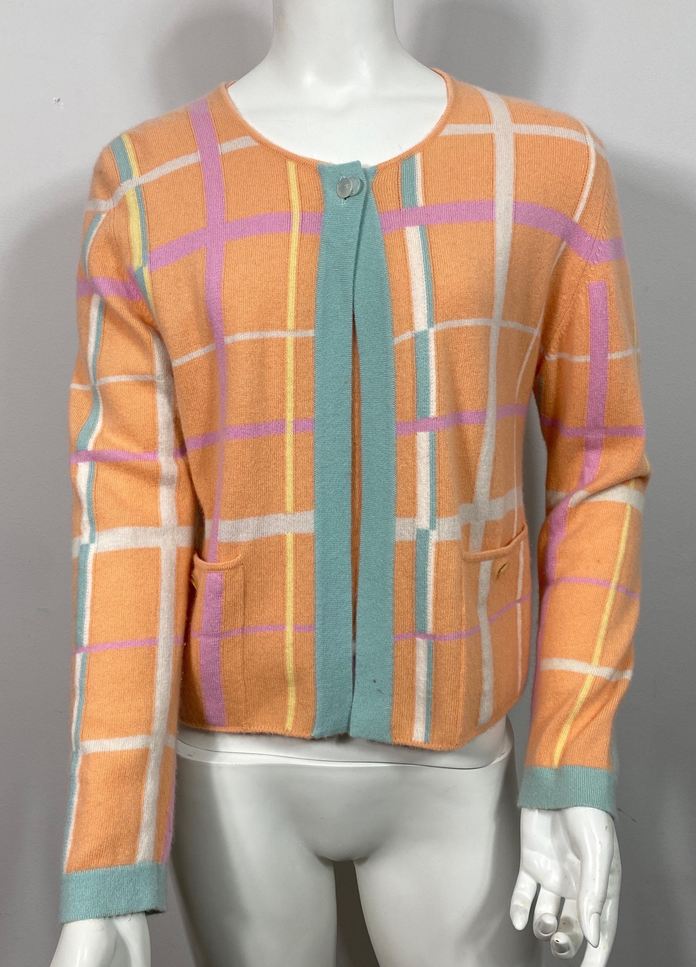 Chanel 1999 Cruise Collection Melon and Pastel Cashmere Sweater Set-Size 42. This soft cashmere sweater set comes from a runway collection from the 1999 Cruise season. The cardigan is primarily a soft melon color with a window pane design in teal,