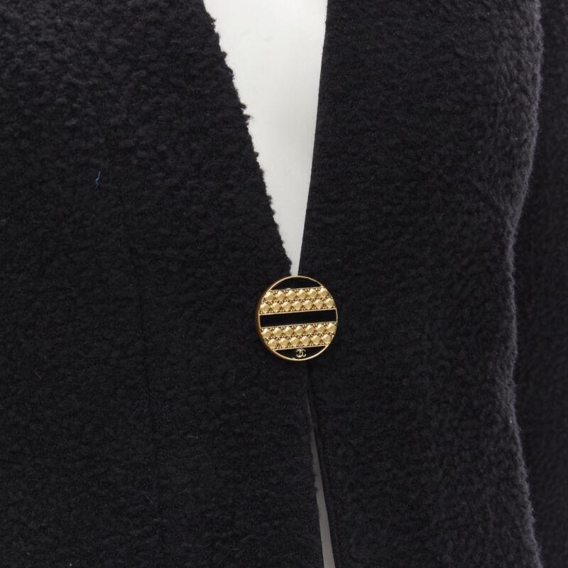 CHANEL 19A black wool boucle gold round shoulder cocoon jacket FR38 M
Reference: KNLM/A00045
Brand: Chanel
Designer: Virginie Viard
Material: Wool, Silk
Color: Black
Pattern: Solid
Closure: Button
Lining:  Silk
Extra Details: Wool-silk boucle.